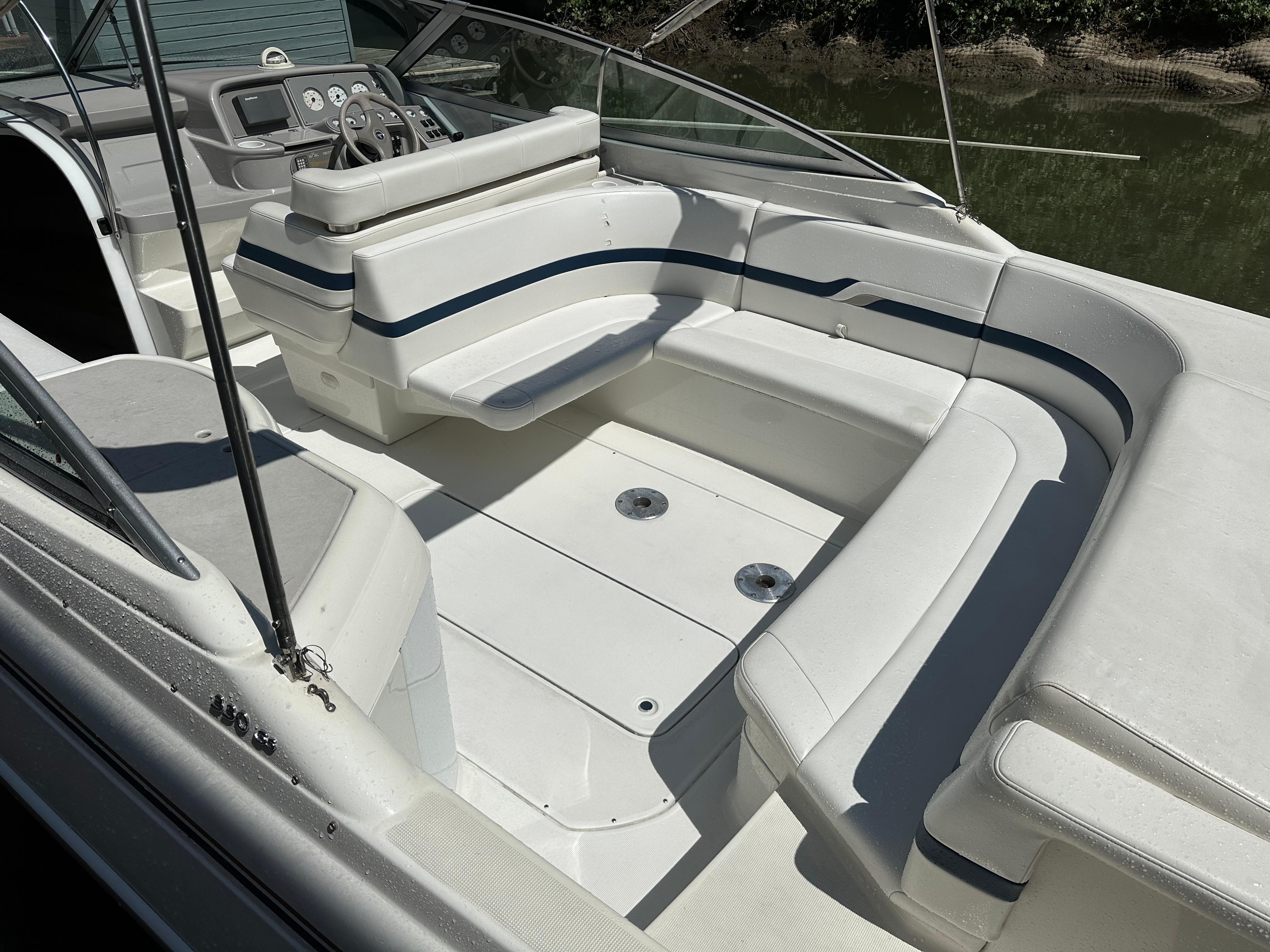 2000 Formula 330 SS boat interior with white seating and steering console.