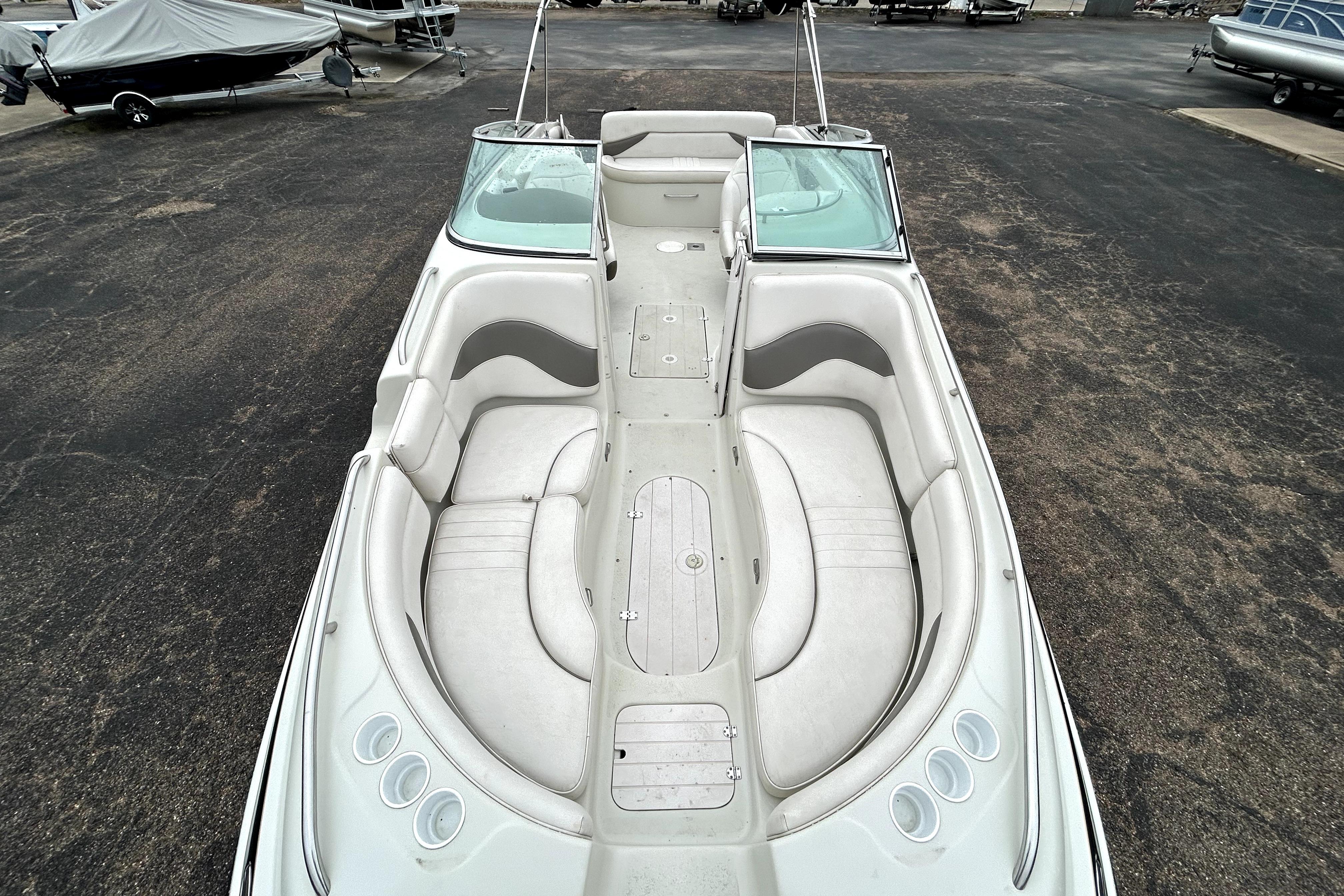 2001 Crownline 239 DB boat with spacious seating and sleek design.