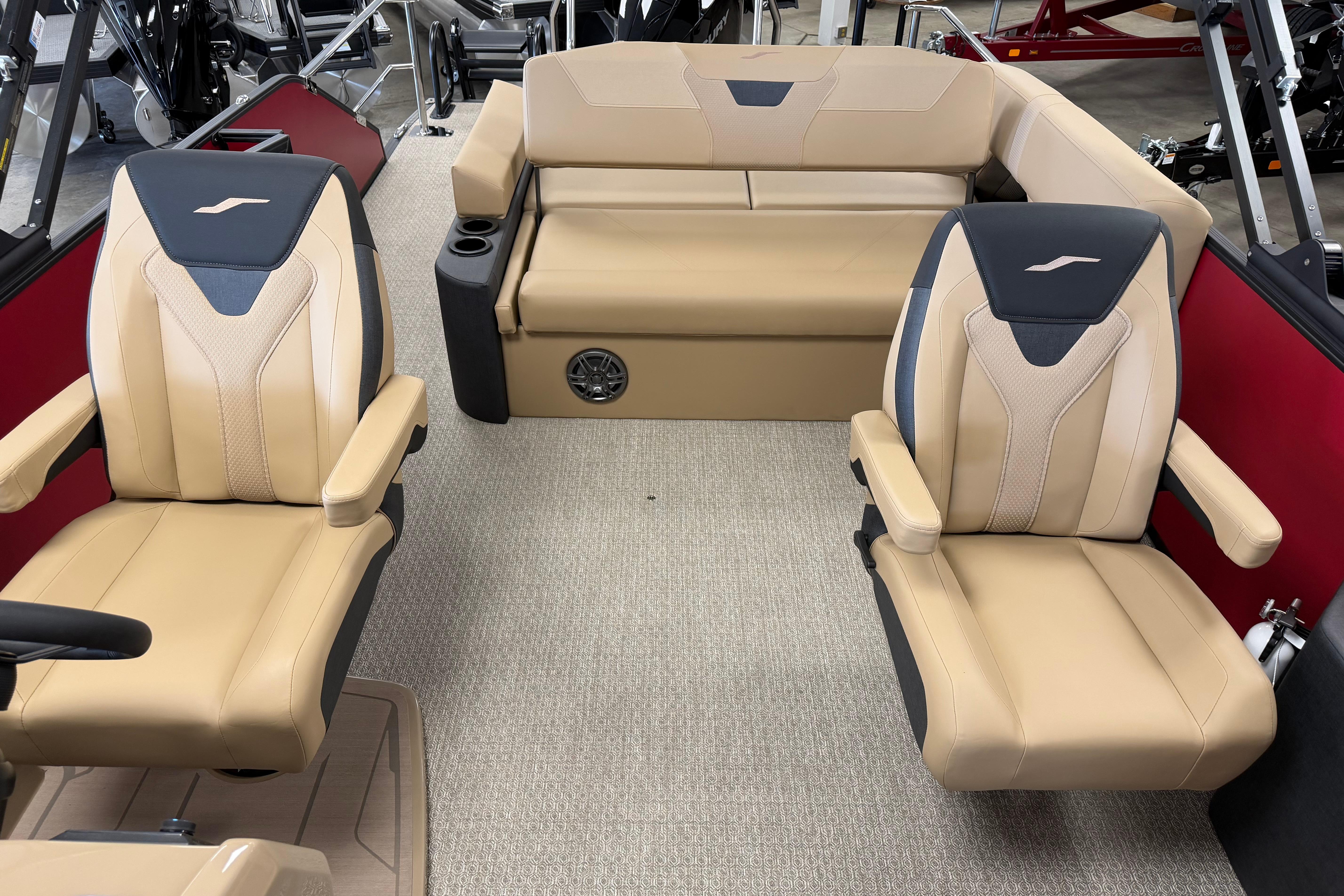Luxurious interior of 2026 Evotti 523CS boat with beige seating and modern design.