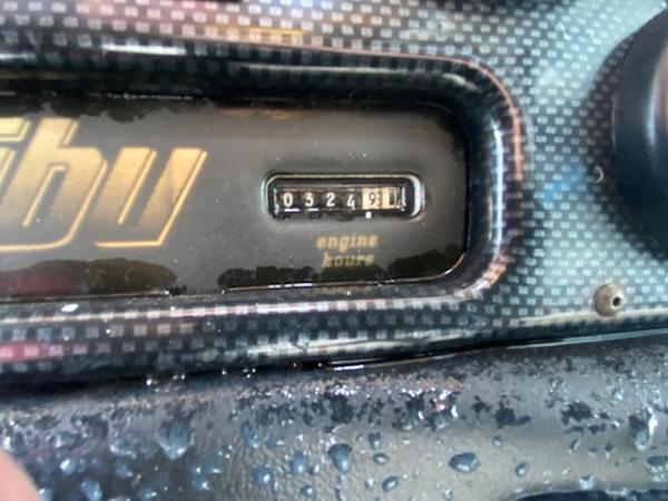 Close-up of 1998 Malibu Response engine hour meter reading 324.9 hours.