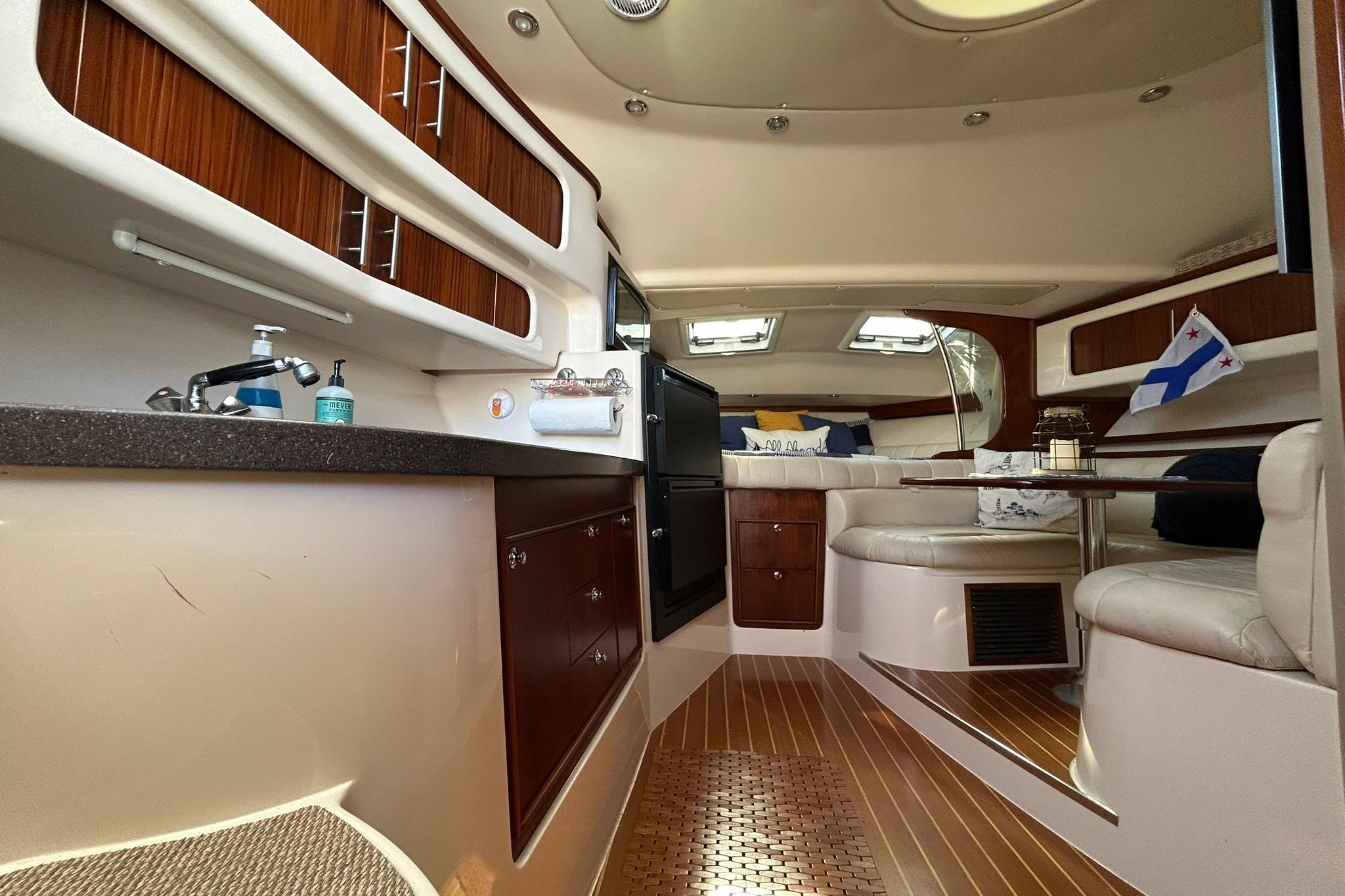 Luxurious interior of a 2007 Grady-White Express 360 boat with elegant wood finishes.