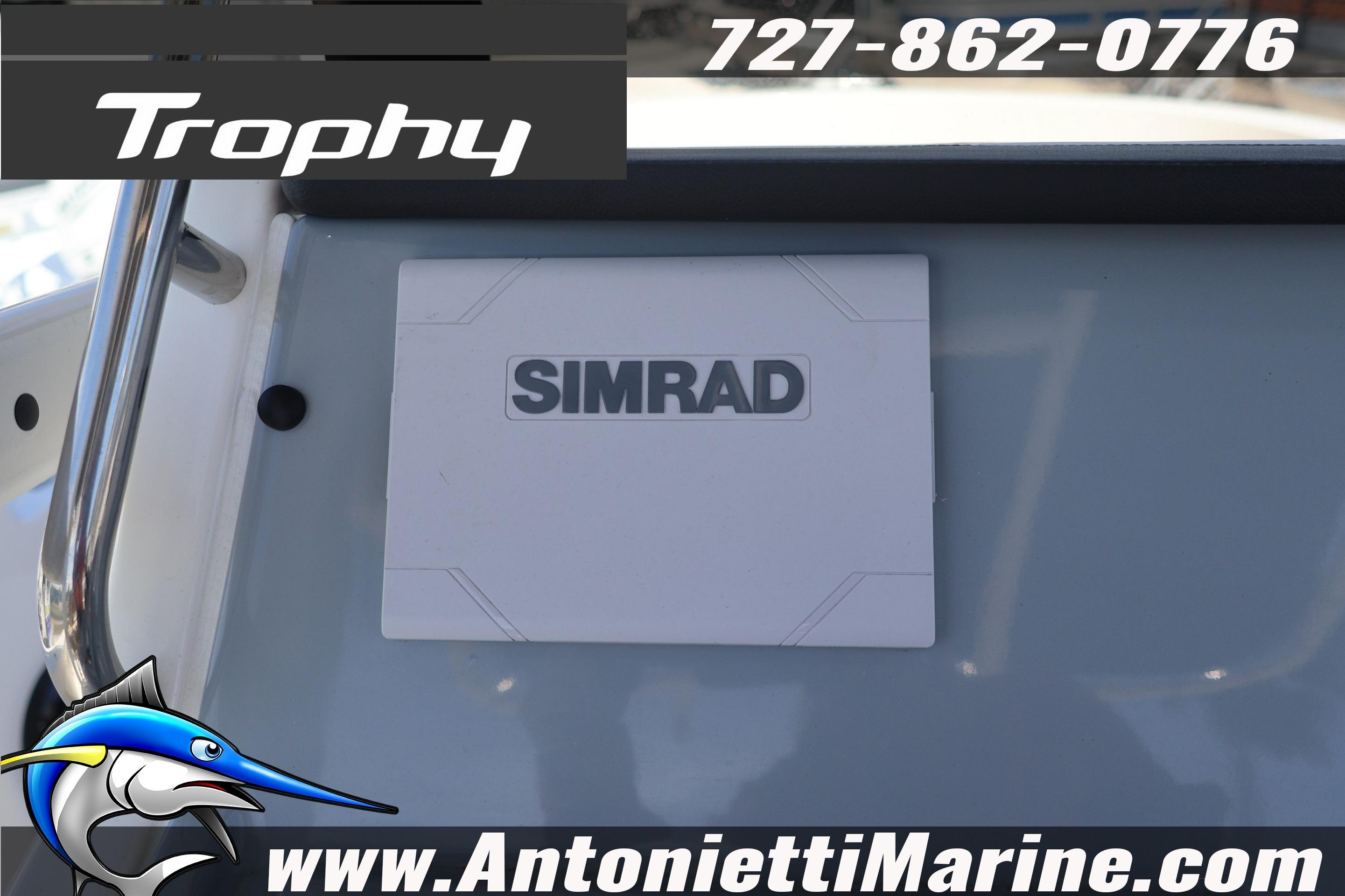 2026 Bayliner Trophy T20CC dashboard with Simrad display, contact info, and logo.