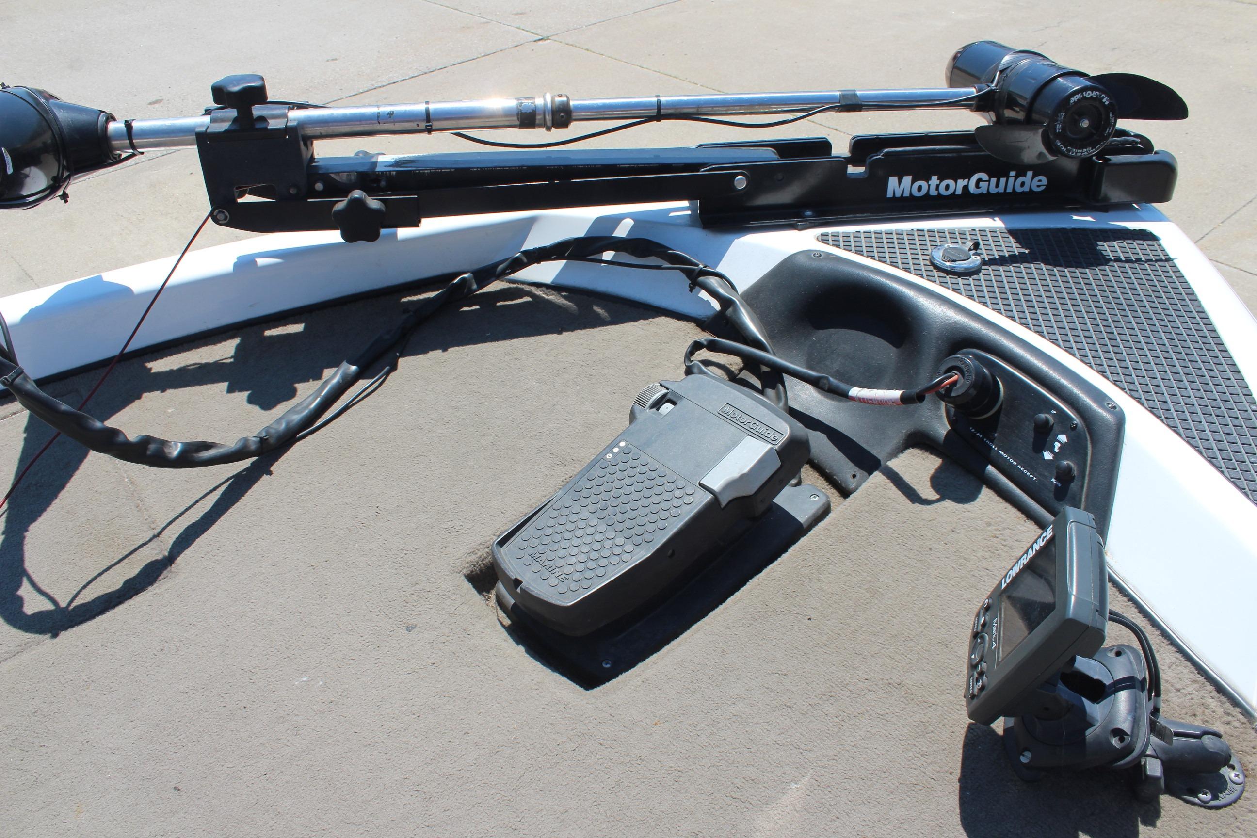 Trolling motor setup on a 2003 Nitro NX 750 SC boat with foot pedal and fish finder.
