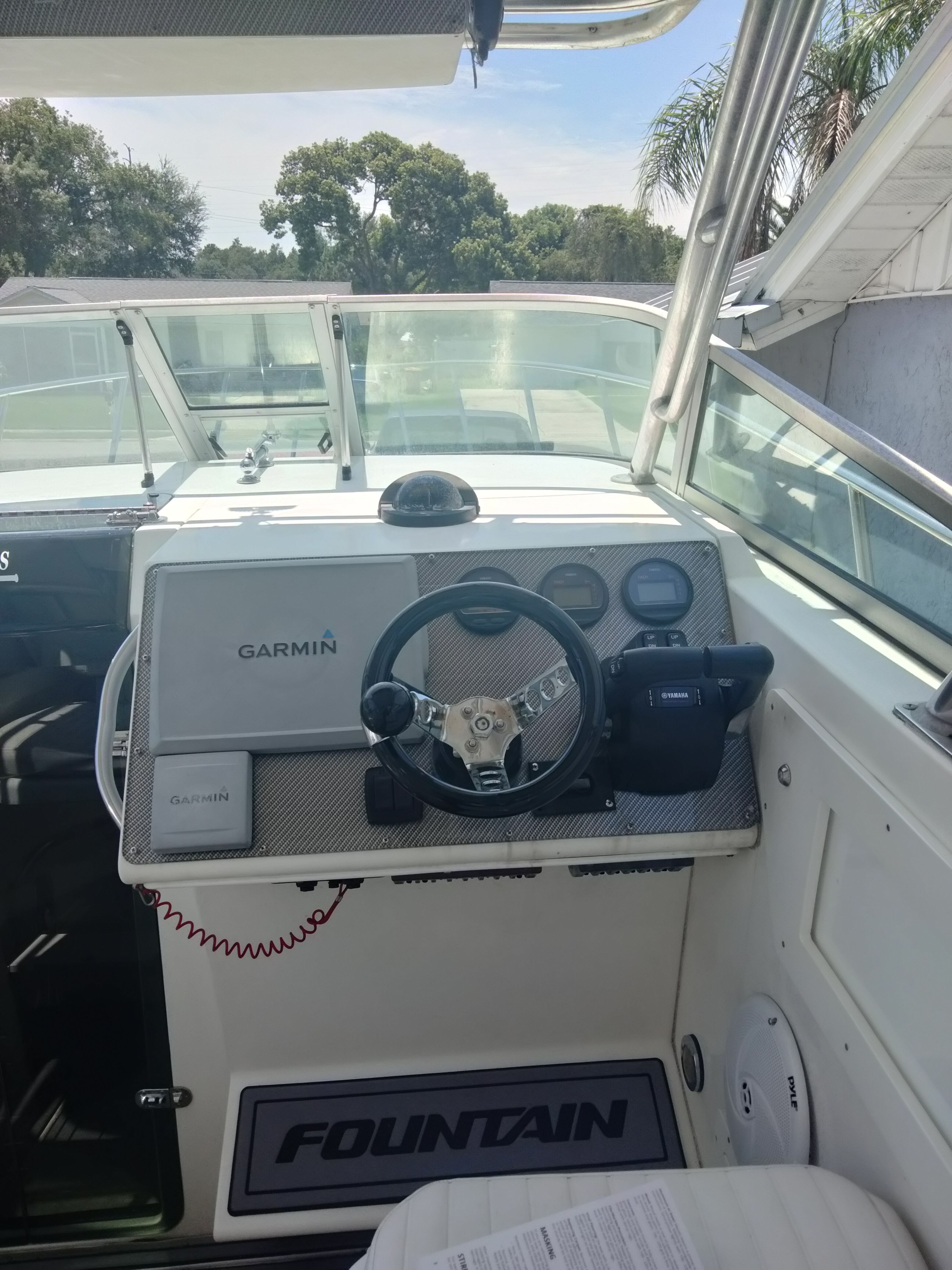 The image shows the helm of a 1995 Fountain 31 SFC boat.