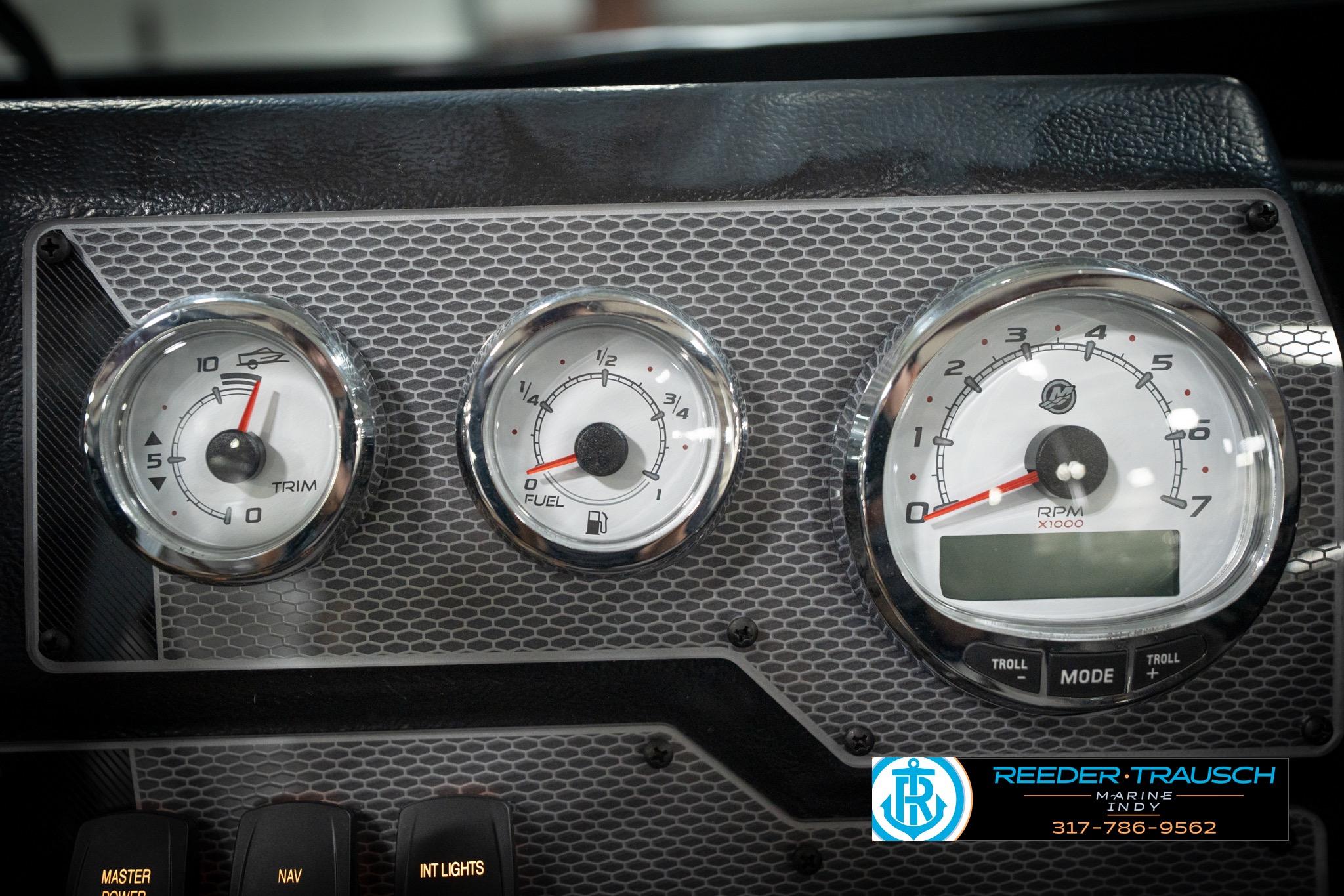 Dashboard gauges of 2026 Lund 2275 Baron boat, featuring trim, fuel, and RPM indicators.