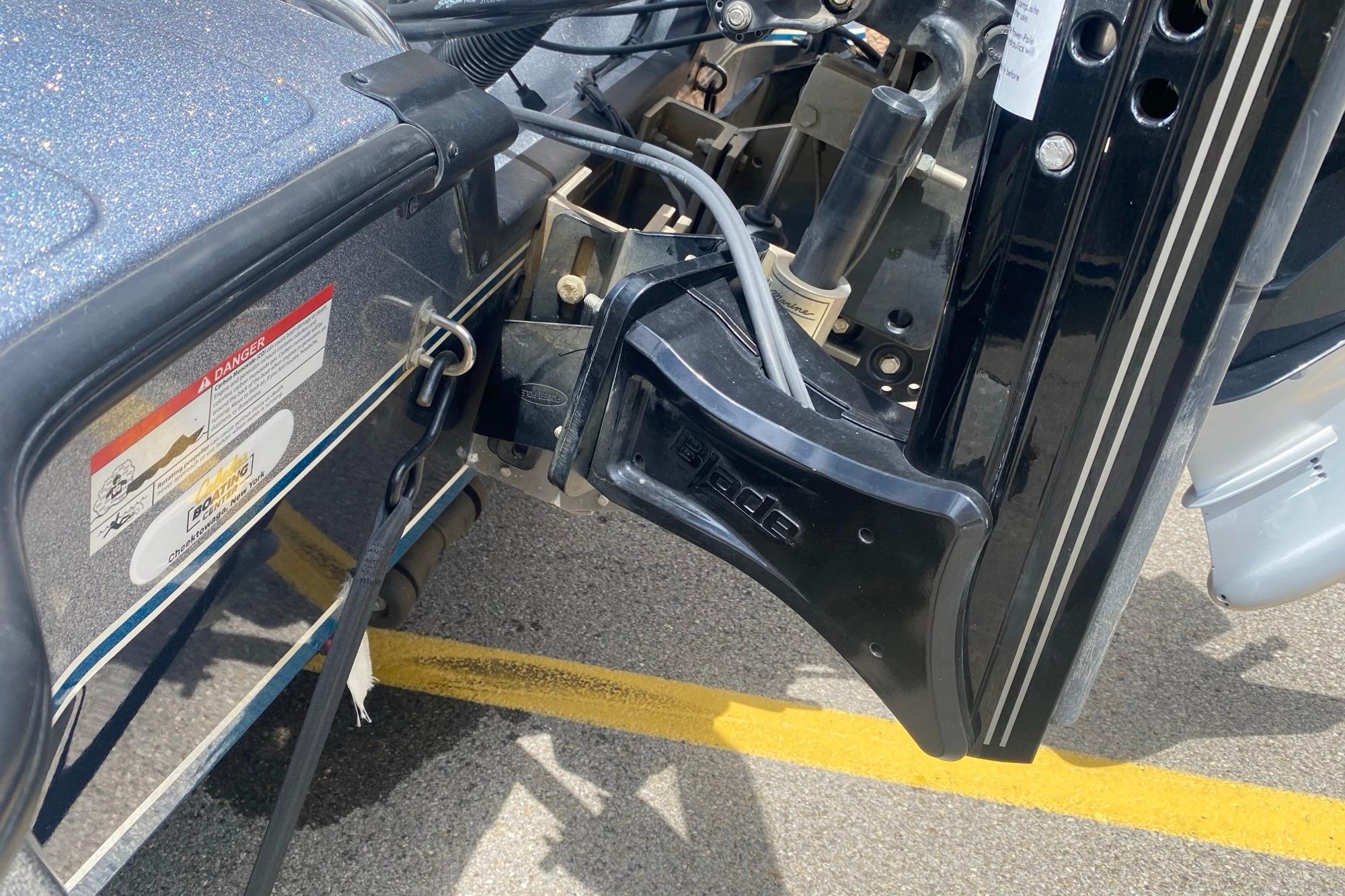 Close-up of a 2020 Triton 20 TrX Patriot boat motor mount and hydraulic system.