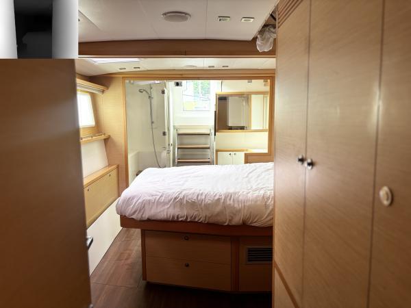 Luxurious interior of 2012 Lagoon 560 yacht with cozy bedroom and modern design.