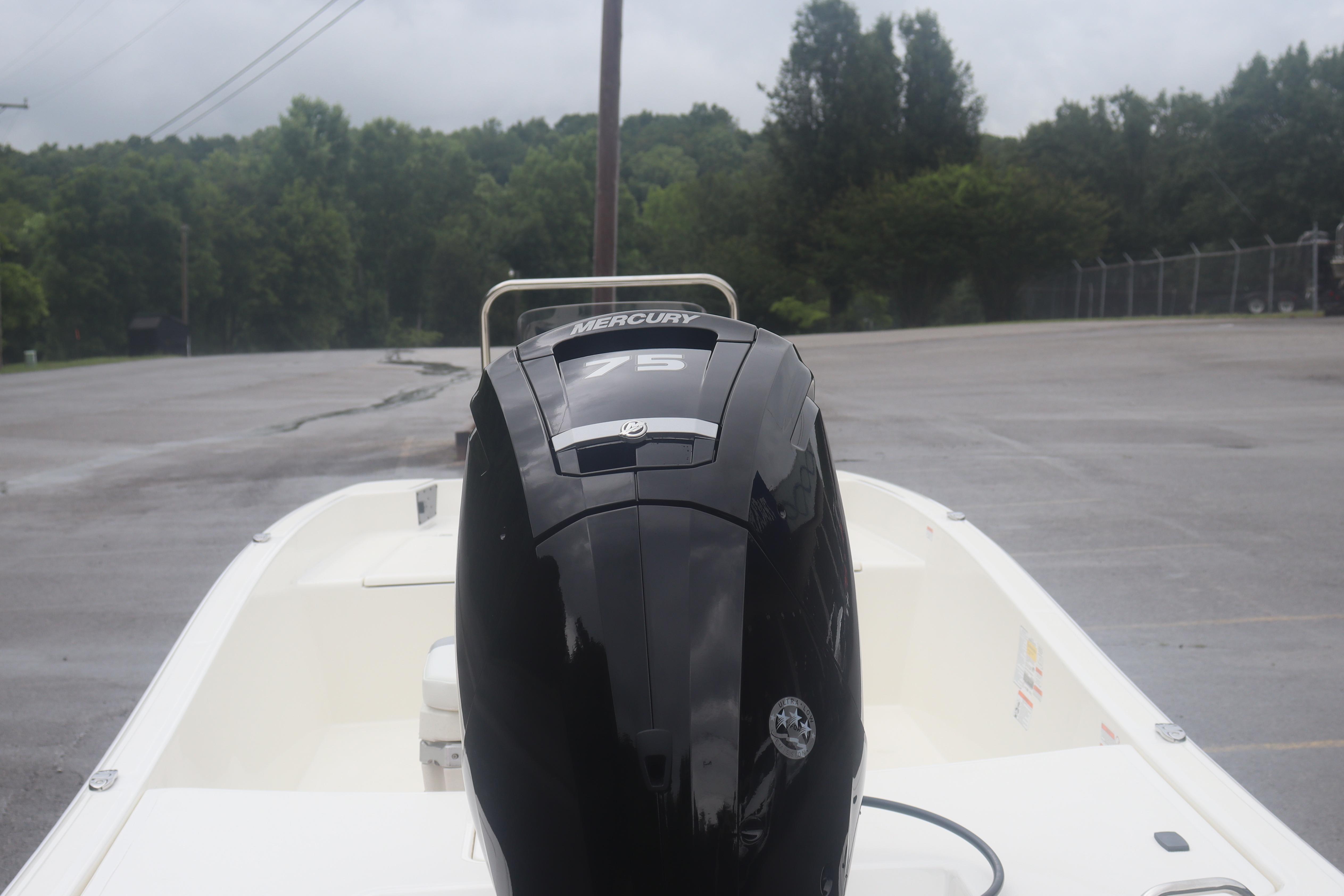 2026 Mako Pro Skiff 17 CC with Mercury 75 engine in a parking lot.
