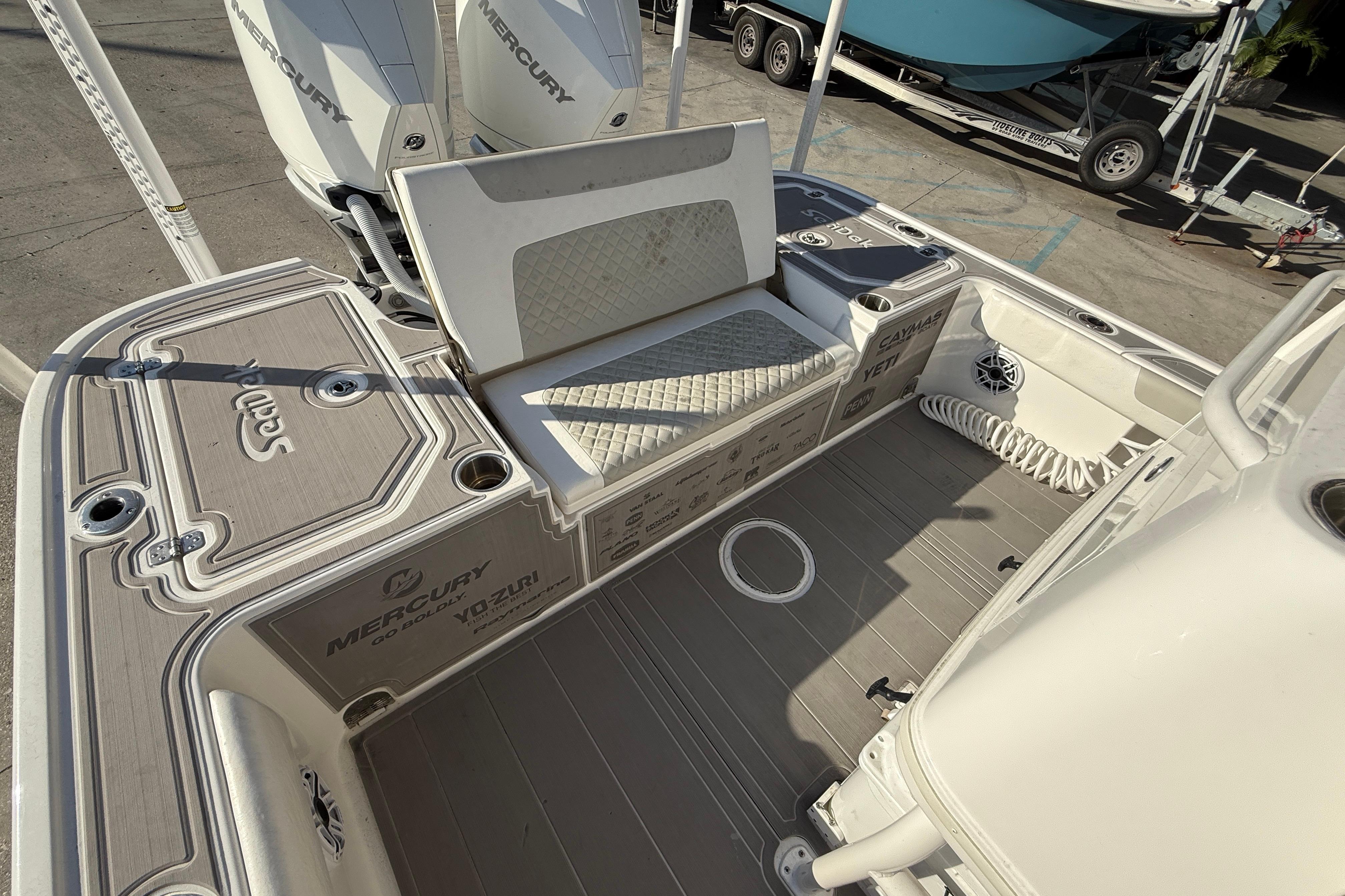 2022 Caymas 28 HB Twin boat deck with seating and Mercury engines.