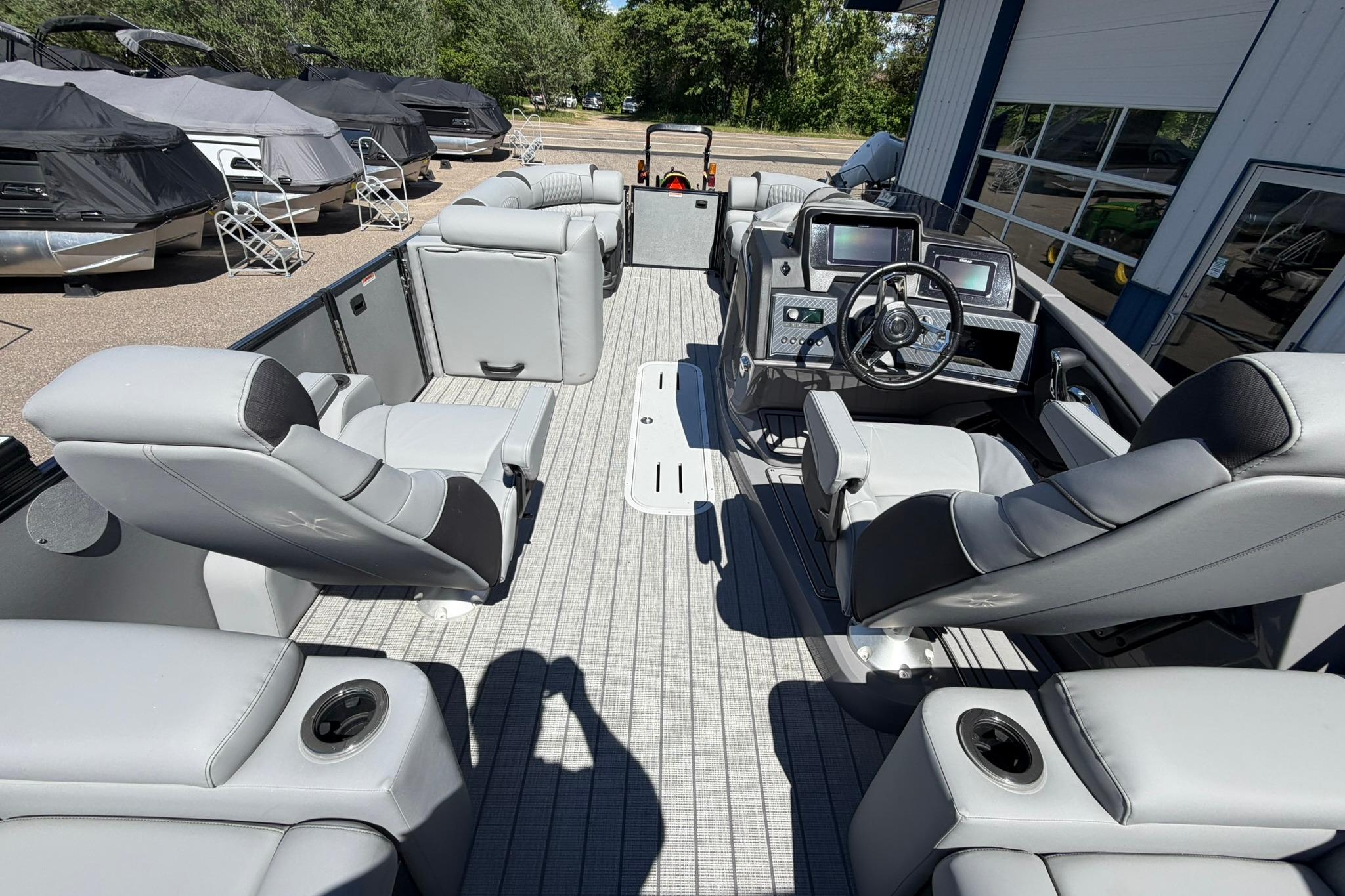 2026 Avalon Catalina Quad Lounge Shift boat interior with modern seating and control panel.
