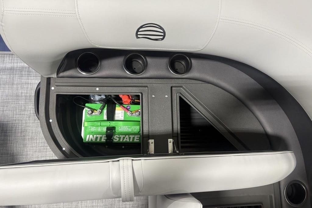 2026 Sun Tracker Party Barge 16 DLX battery compartment with Interstate battery visible.