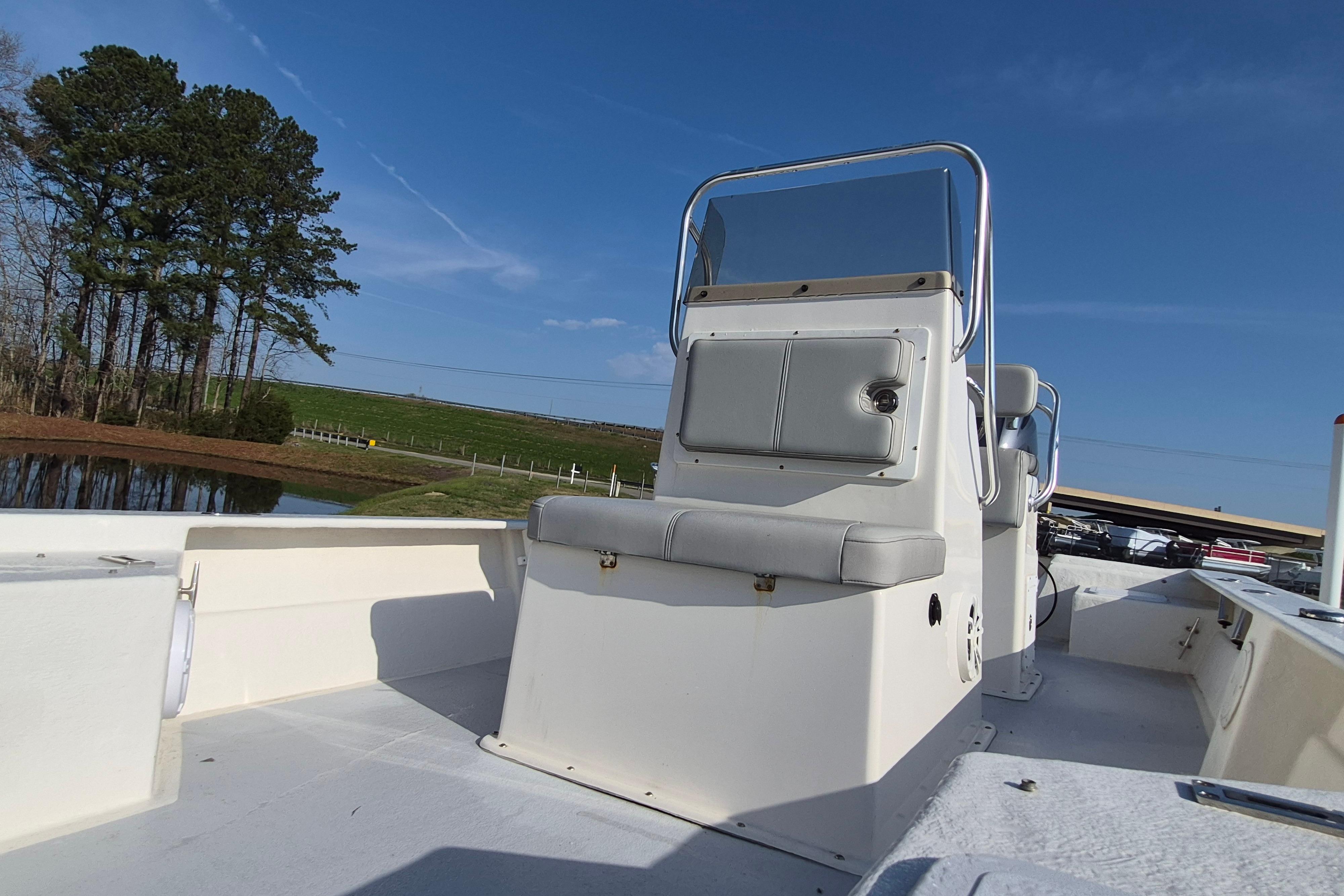 2024 May-Craft 22 Hancock Skiff boat with center console, set against a scenic outdoor backdrop.