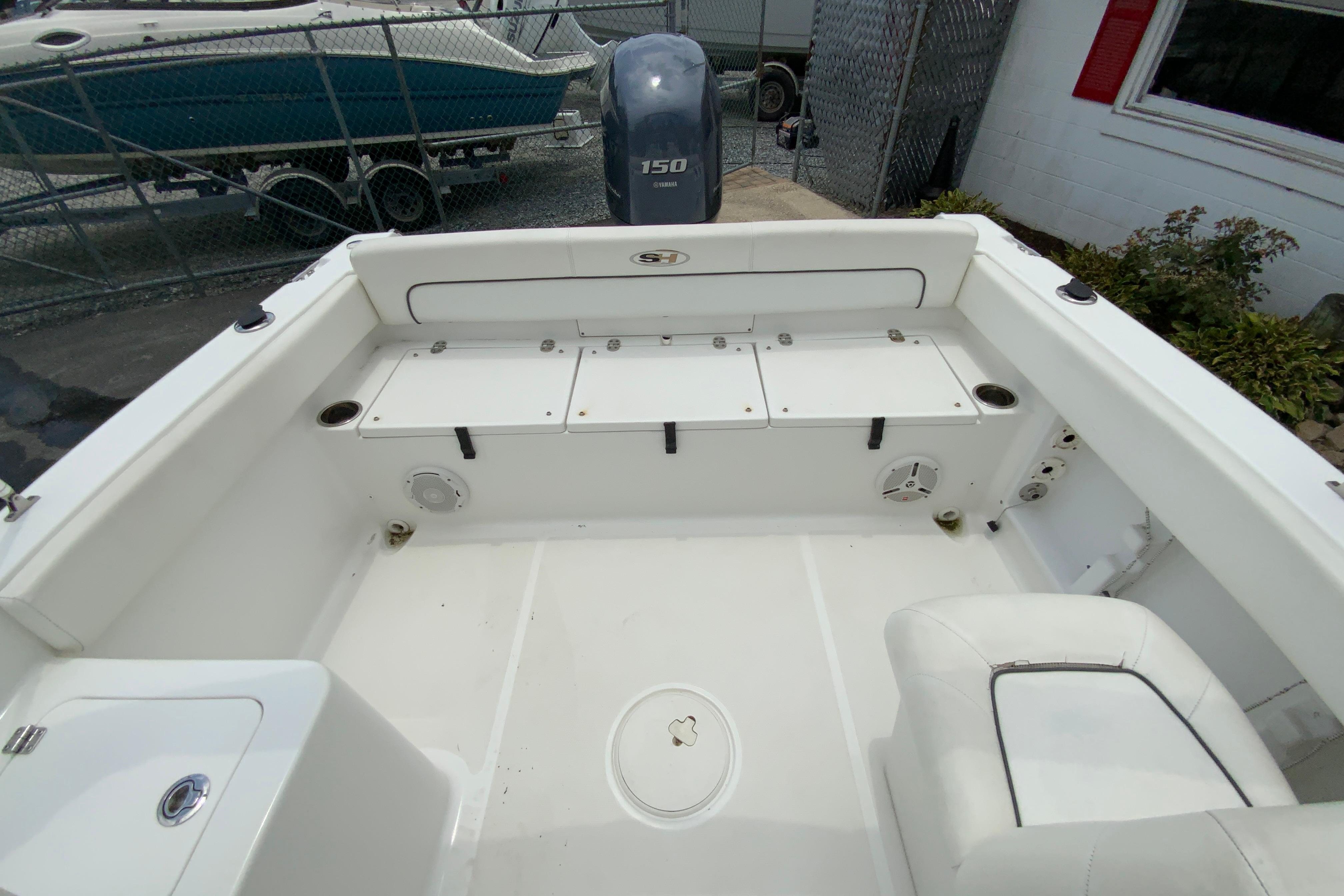 2014 Sea Hunt Escape 211 LE boat interior with seating and storage compartments.