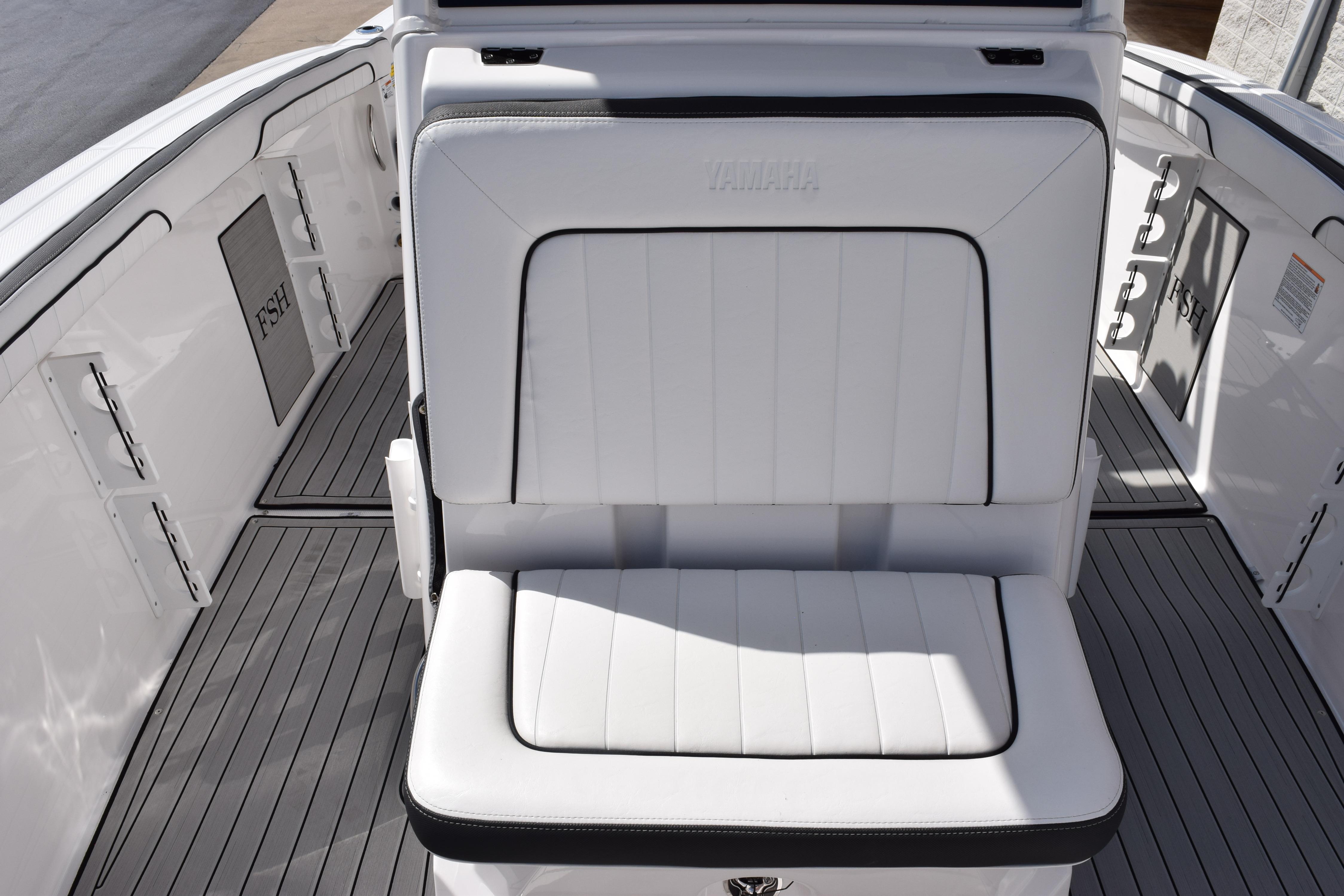 2026 Yamaha Boats 255 FSH Sport H interior with white seating and sleek design.