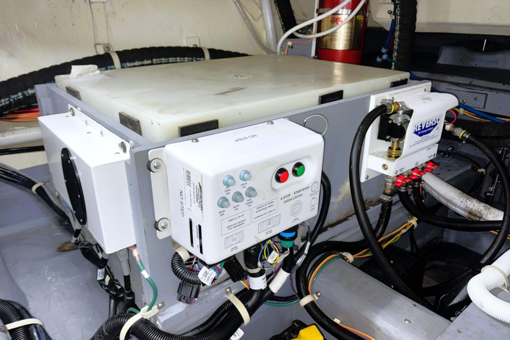 Engine compartment of 2016 Carver C40 with control panels and wiring.