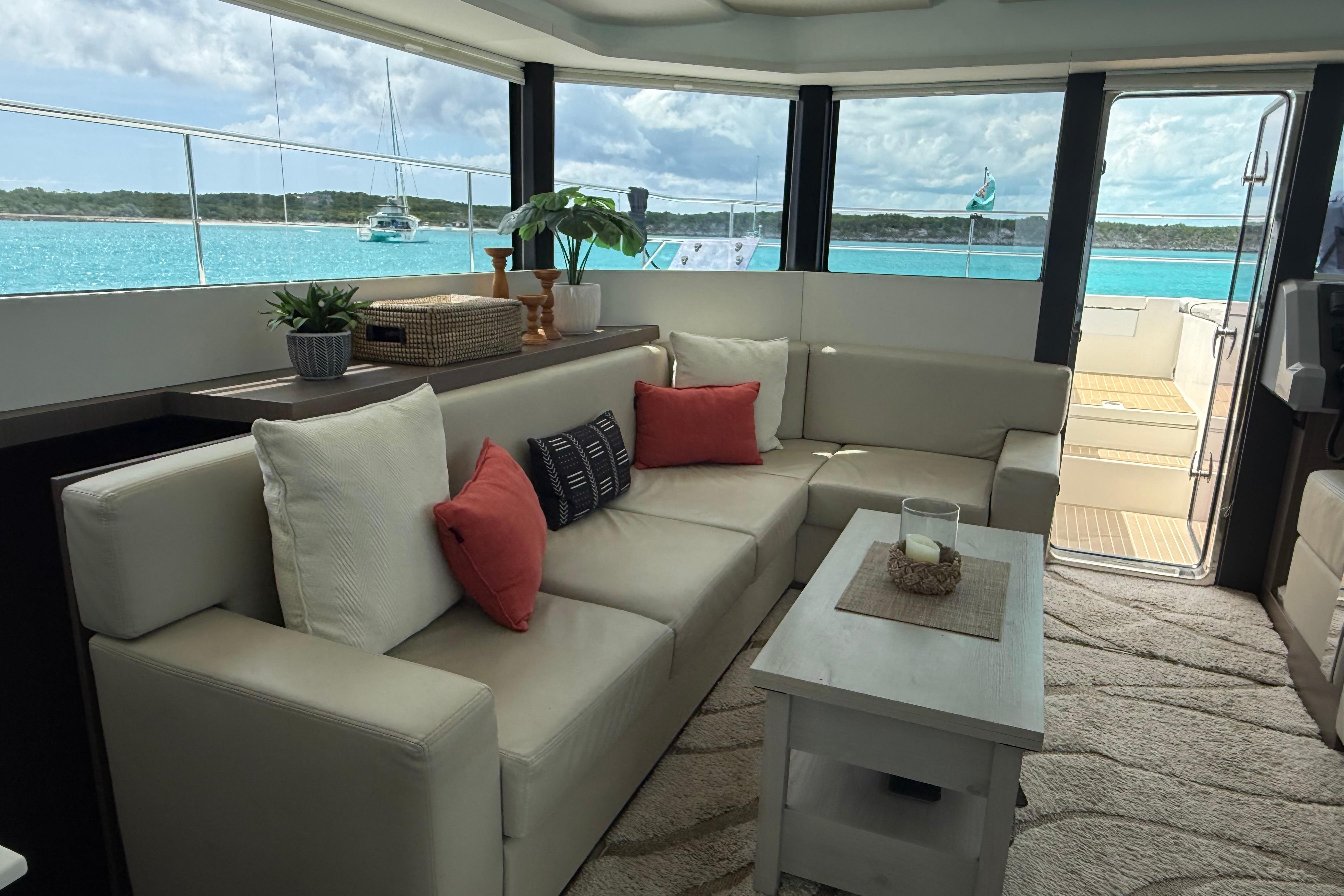 Luxurious interior of 2021 Leopard 53 Powercat yacht with ocean view.