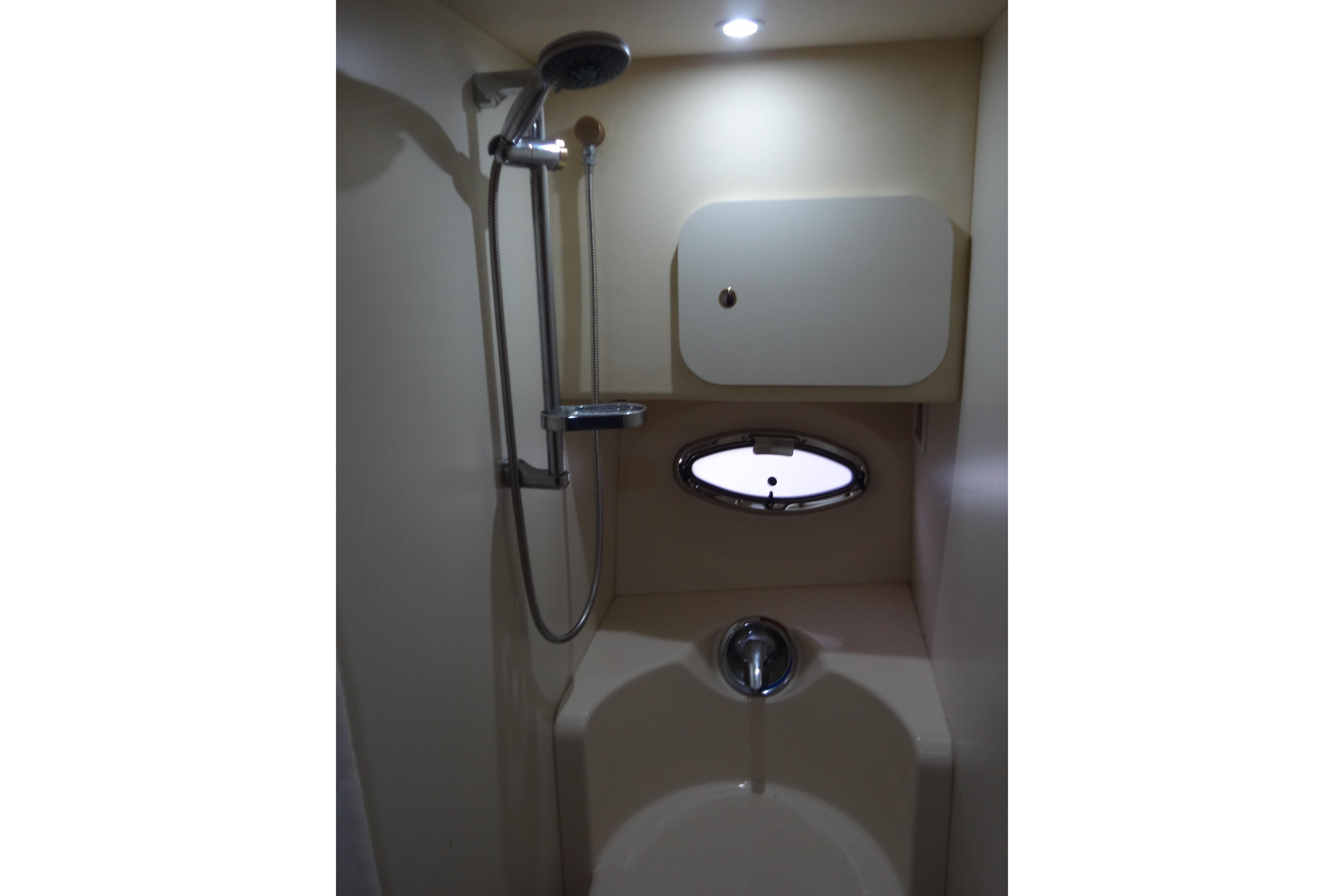 Bathroom shower area in a 2005 Silverton 34 Convertible yacht.