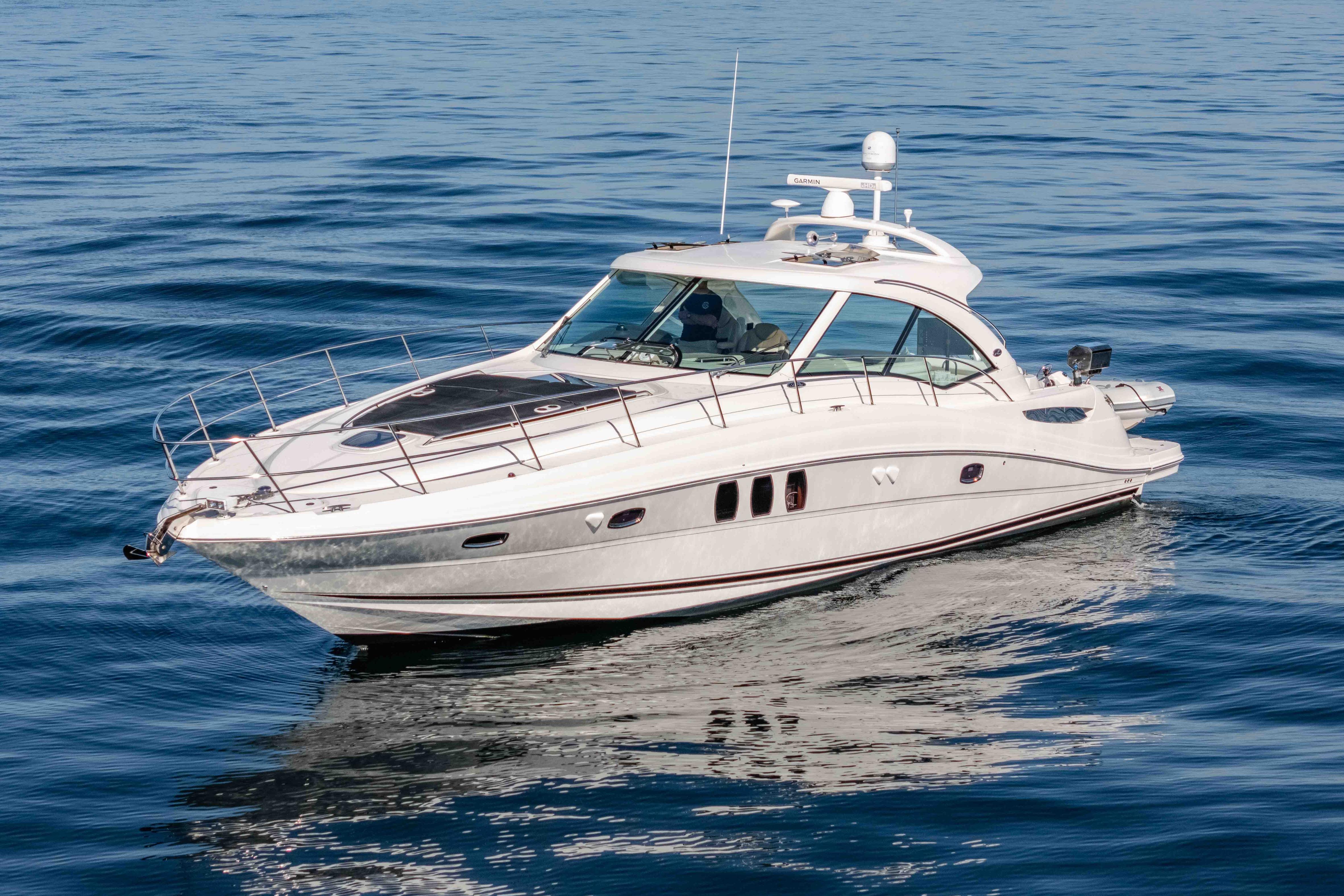 2007 Sea Ray 48 Sundancer yacht cruising on calm blue waters.