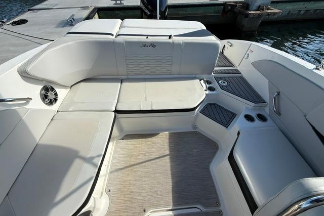 2022 Sea Ray SPX 210 Outboard boat interior with white seating and modern design.