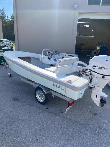 2024 Ultra Lite Tenders ULT 380 boat with Tohatsu engine on a trailer.