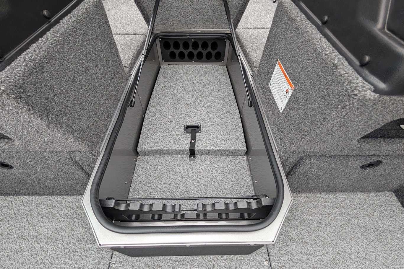 2026 Lund 1875 Impact XS Sport boat storage compartment, gray interior, open lid.