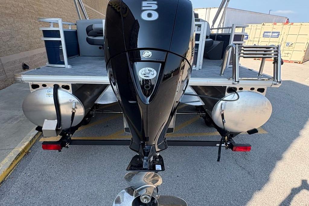 2026 Sun Tracker SportFish 22 DLX pontoon boat with a 50 HP outboard motor.