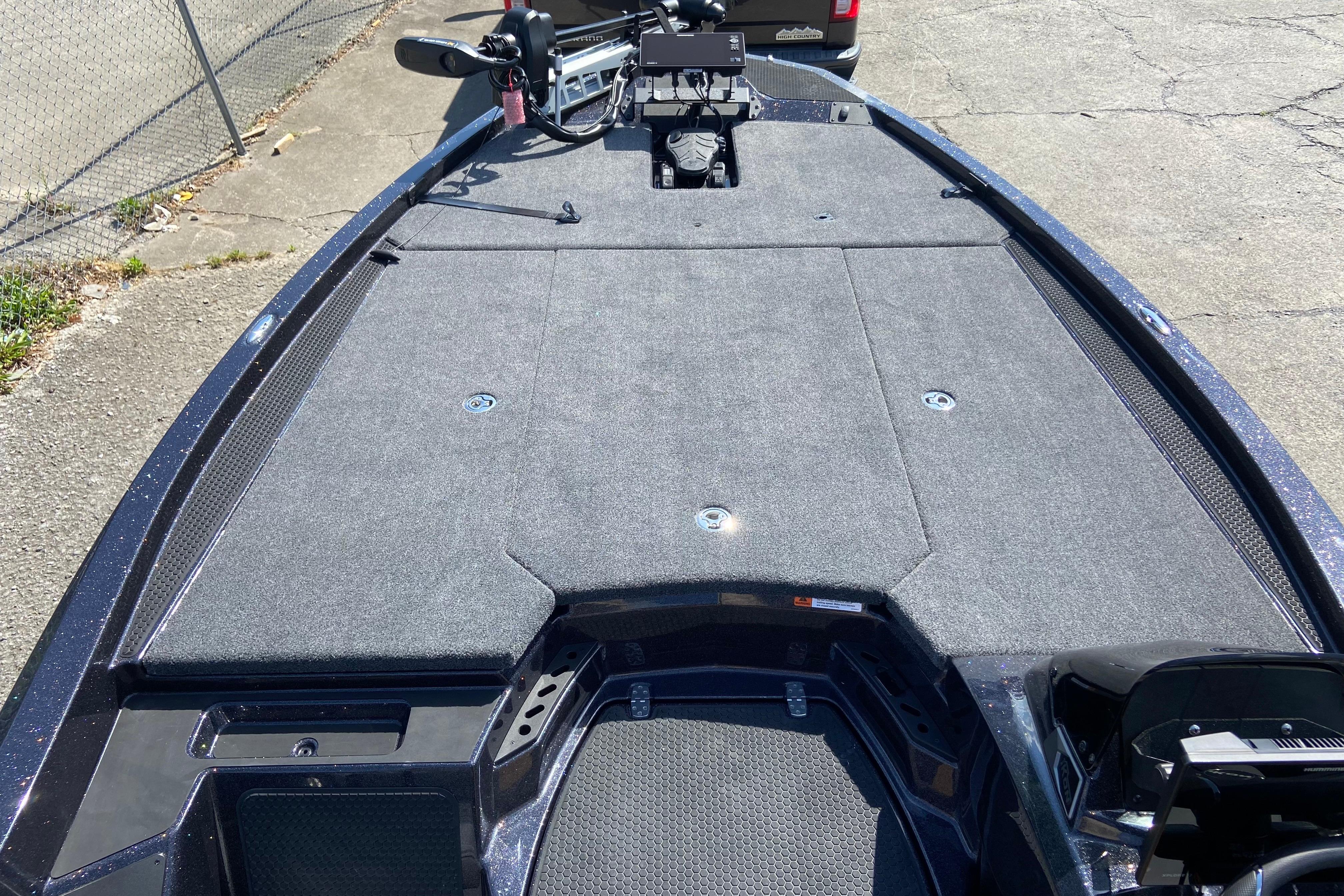 Front deck of 2026 iKon VLX 21 boat with carpeted surface and equipment.