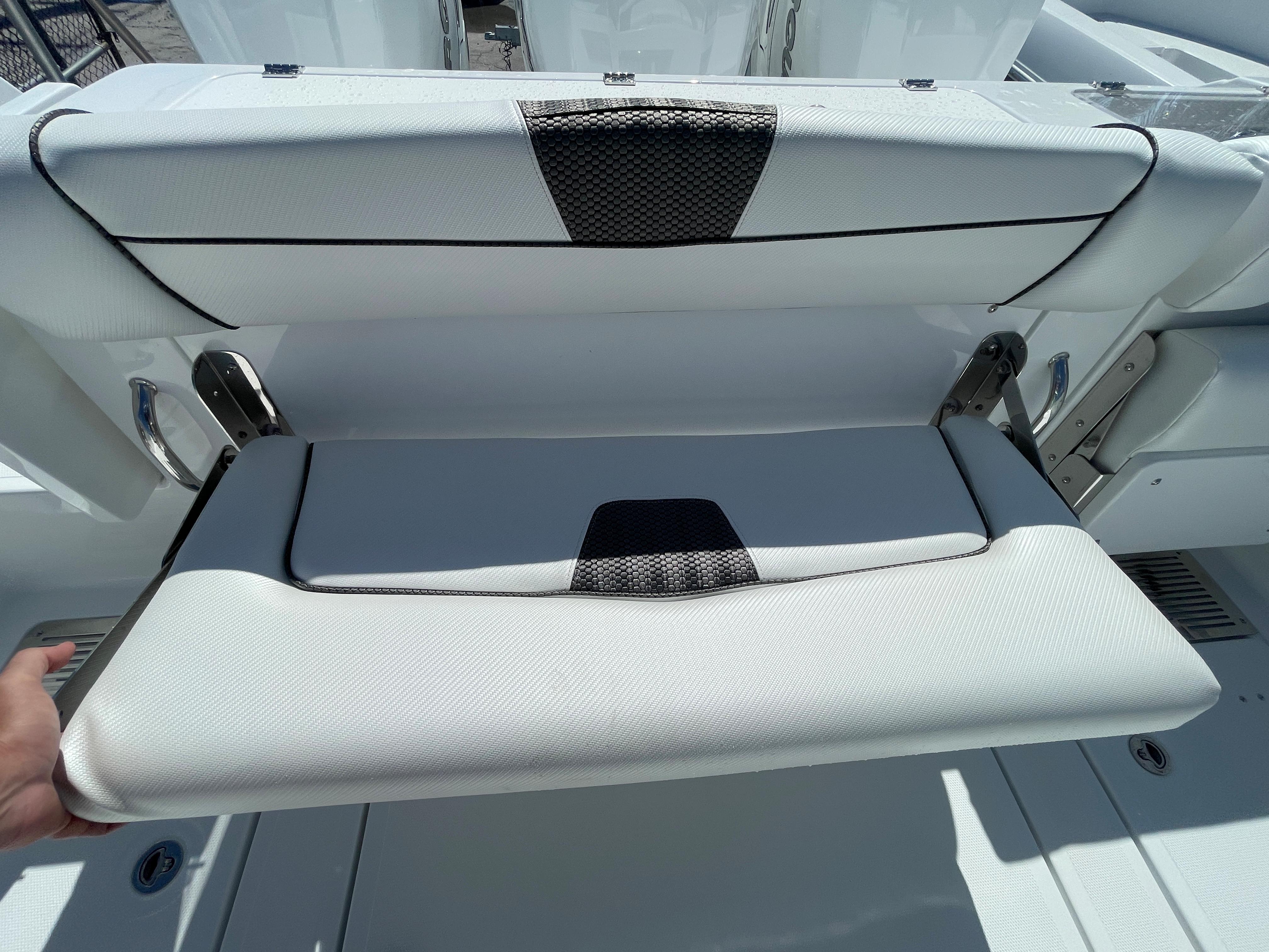 2023 Wellcraft 352 Fisherman boat seat with foldable design and modern upholstery.