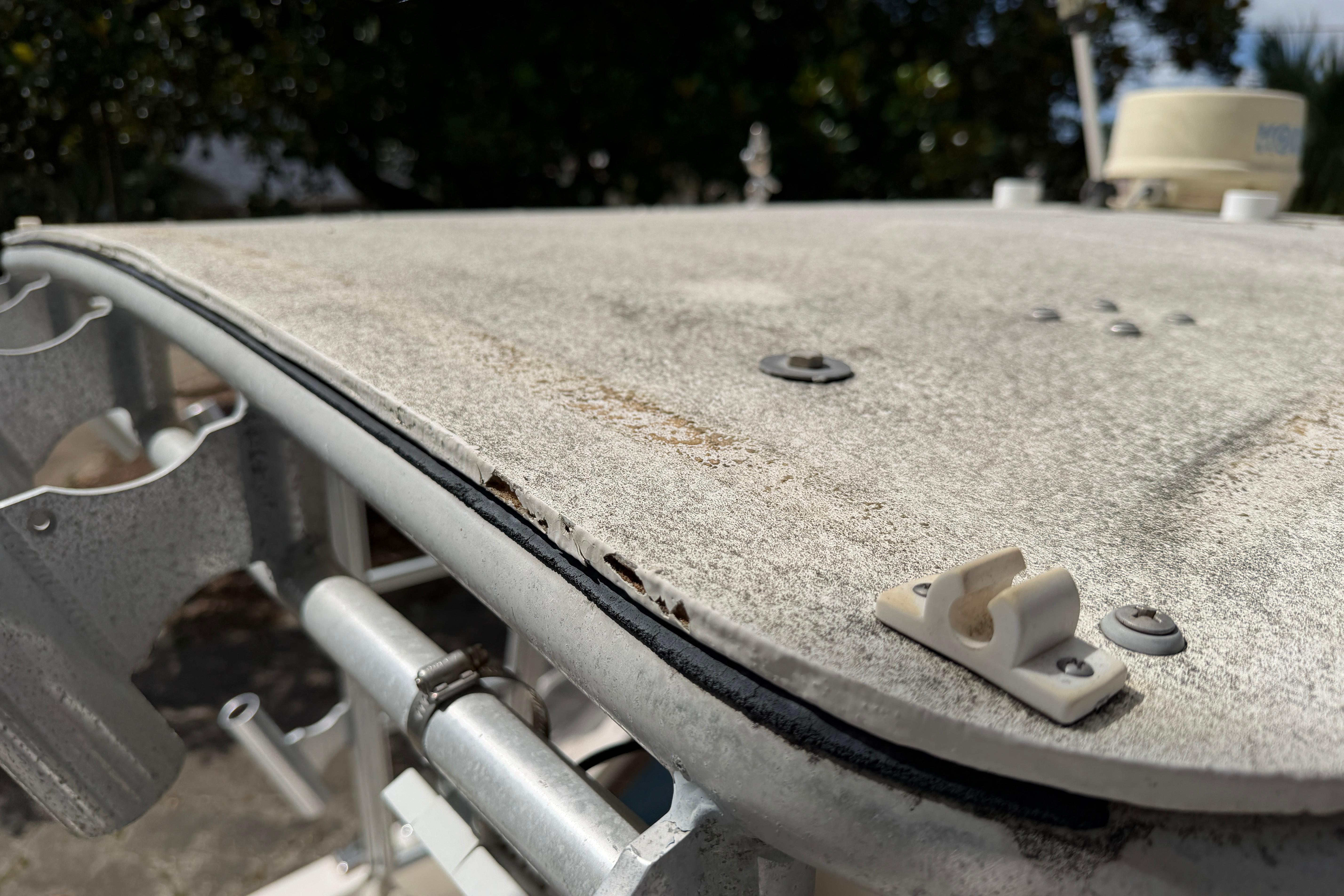 Close-up of 1987 Grady-White Seafarer 226 boat's weathered surface and fittings.