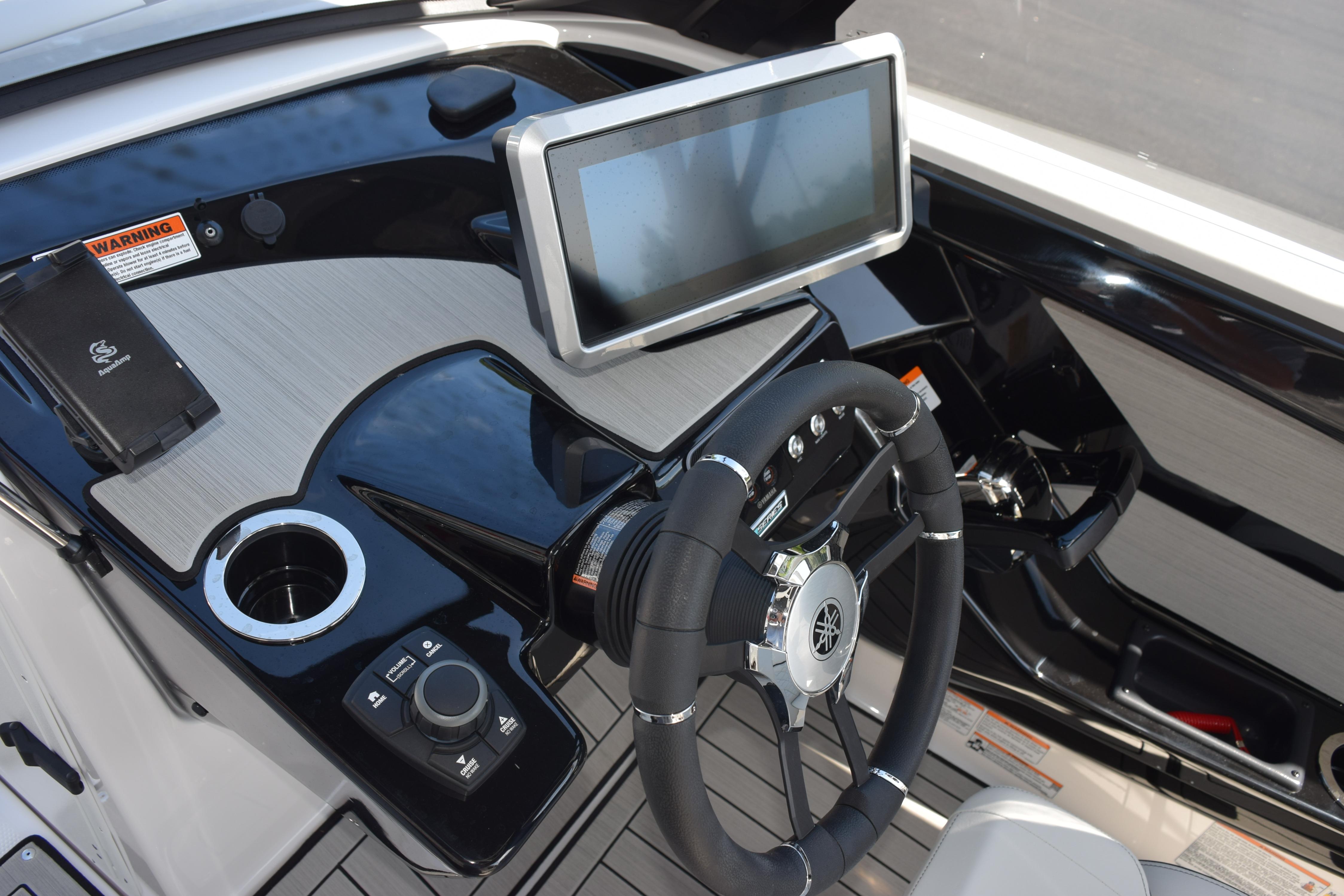 2026 Yamaha Boats 222SE dashboard with steering wheel and touchscreen display.