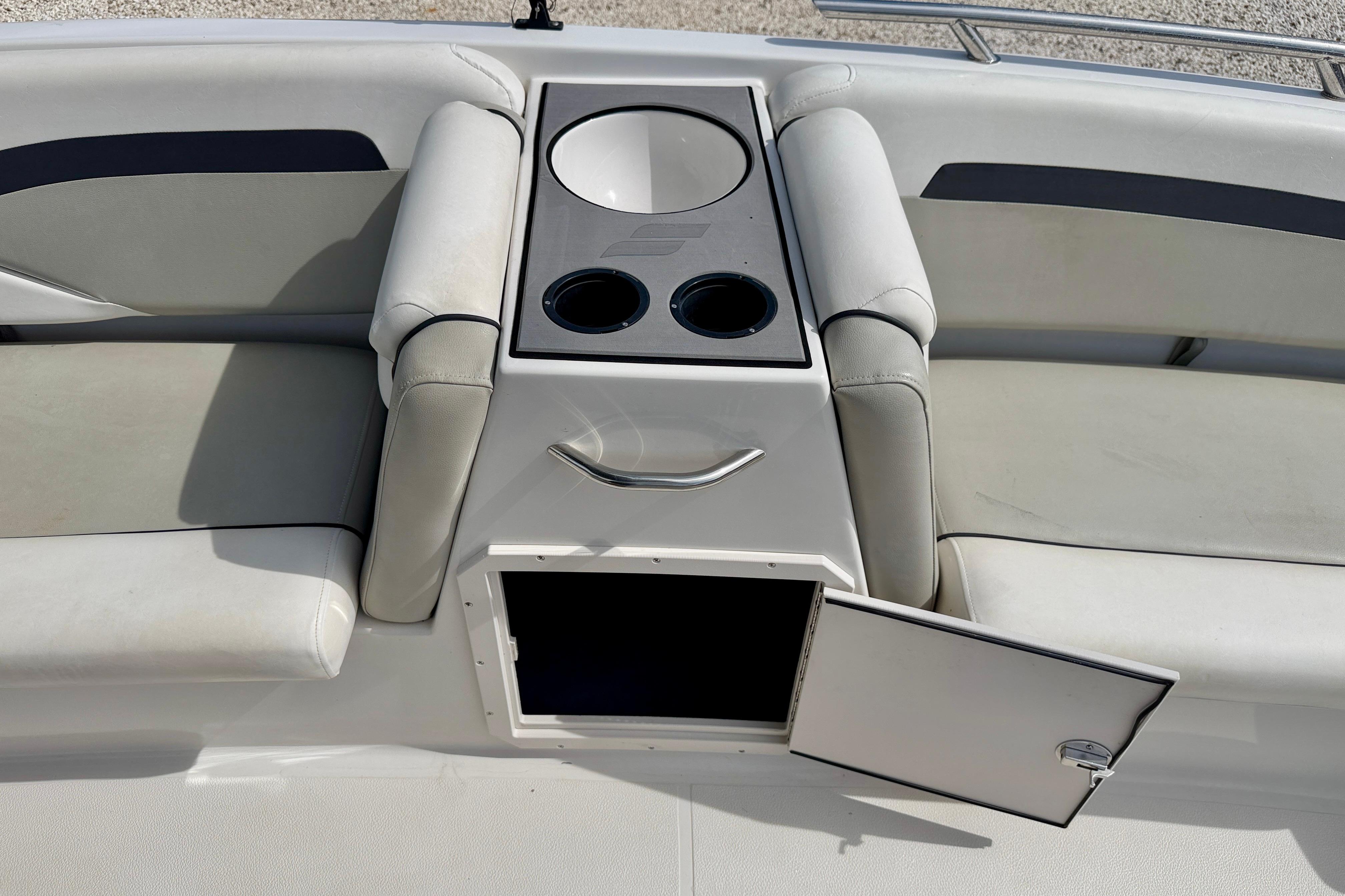 2021 Starcraft SVX 191 OB boat interior with seating, cup holders, and storage compartment.