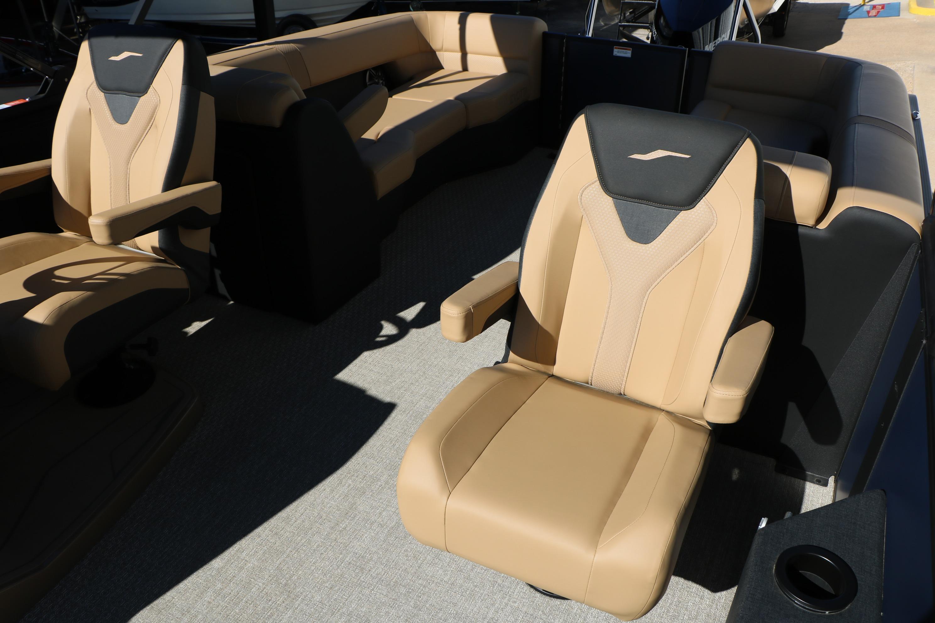 Luxurious seating on the 2026 Evotti 525 QL Tri-Toon boat, featuring tan upholstery.