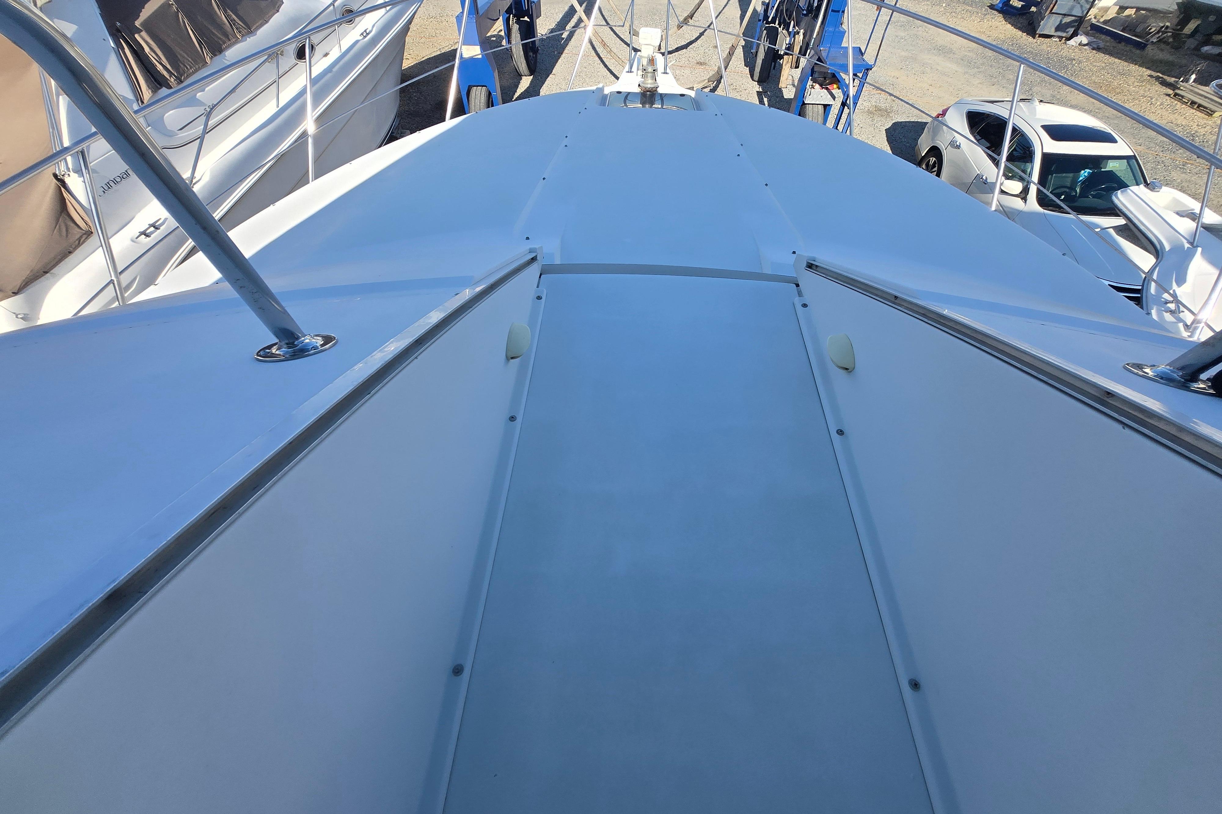 1994 Carver 380 Santego yacht deck view, showcasing sleek design and spacious layout.