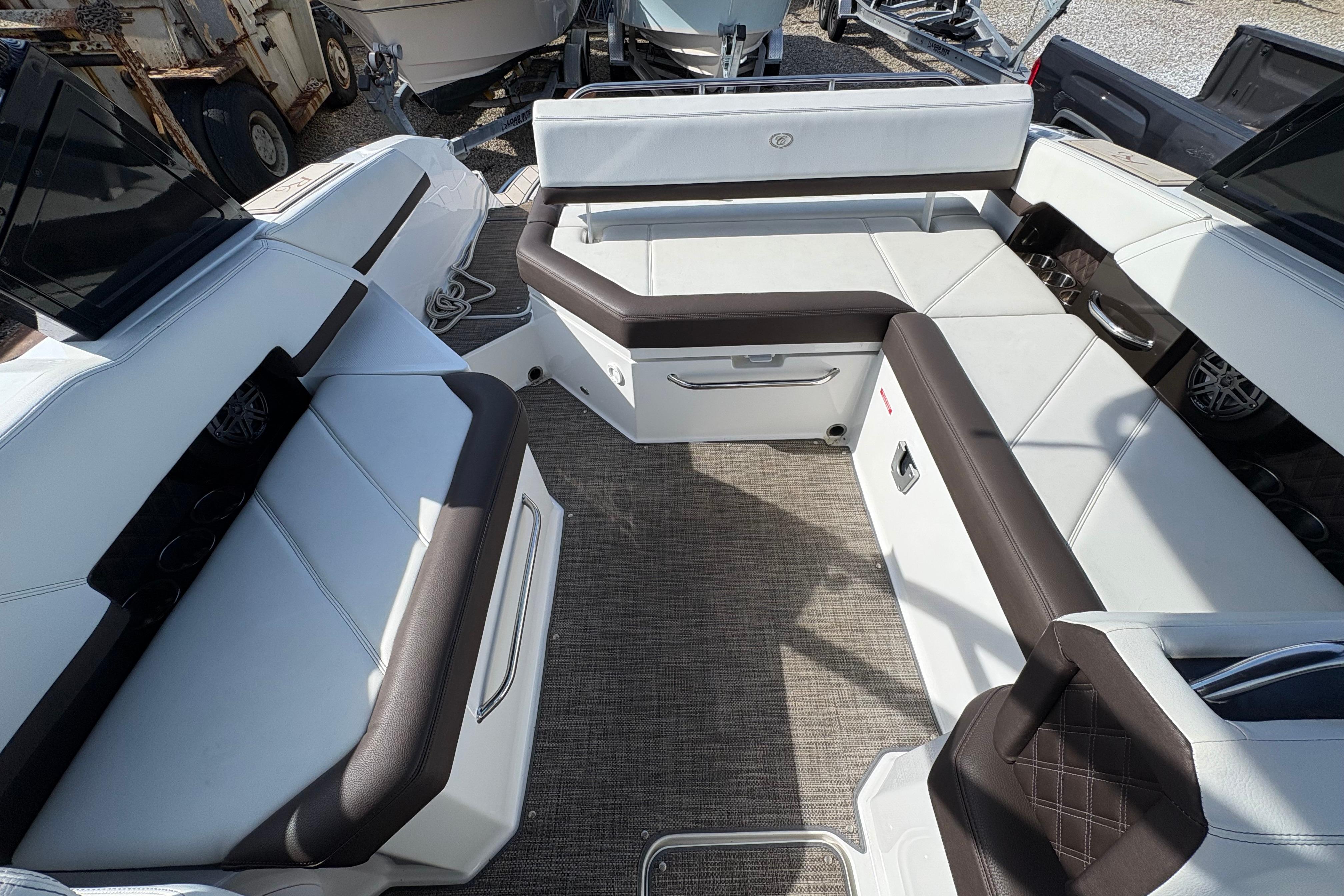 2022 Cobalt R6 boat interior with white and brown seating, featuring modern design.