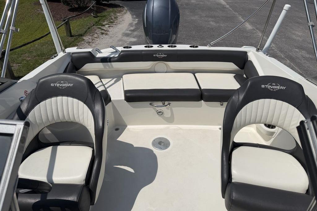 2019 Stingray 201 DS boat interior with black and white seating and sleek design.
