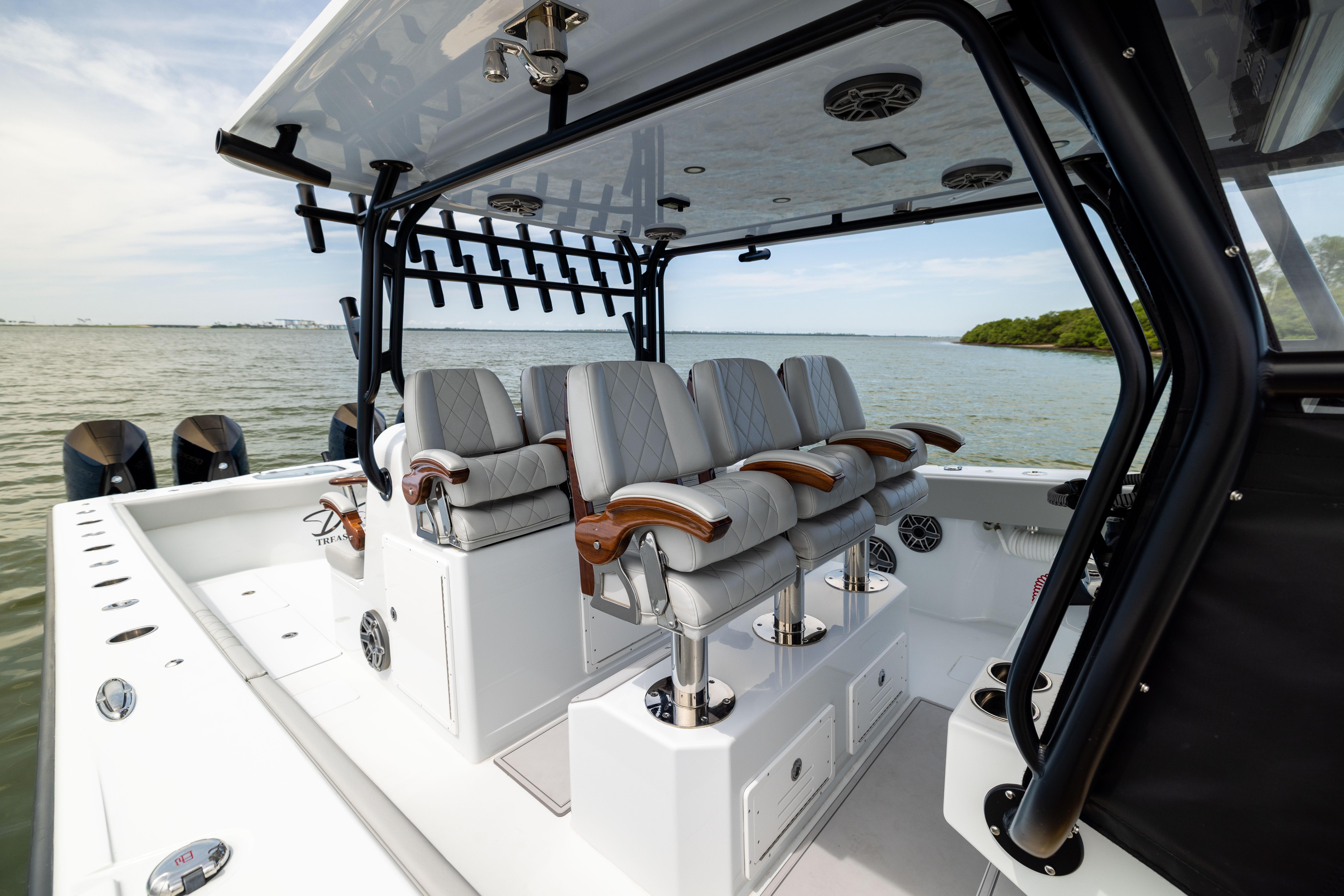 Luxurious 2025 Freeman 42 LR boat interior with plush seating and scenic water view.
