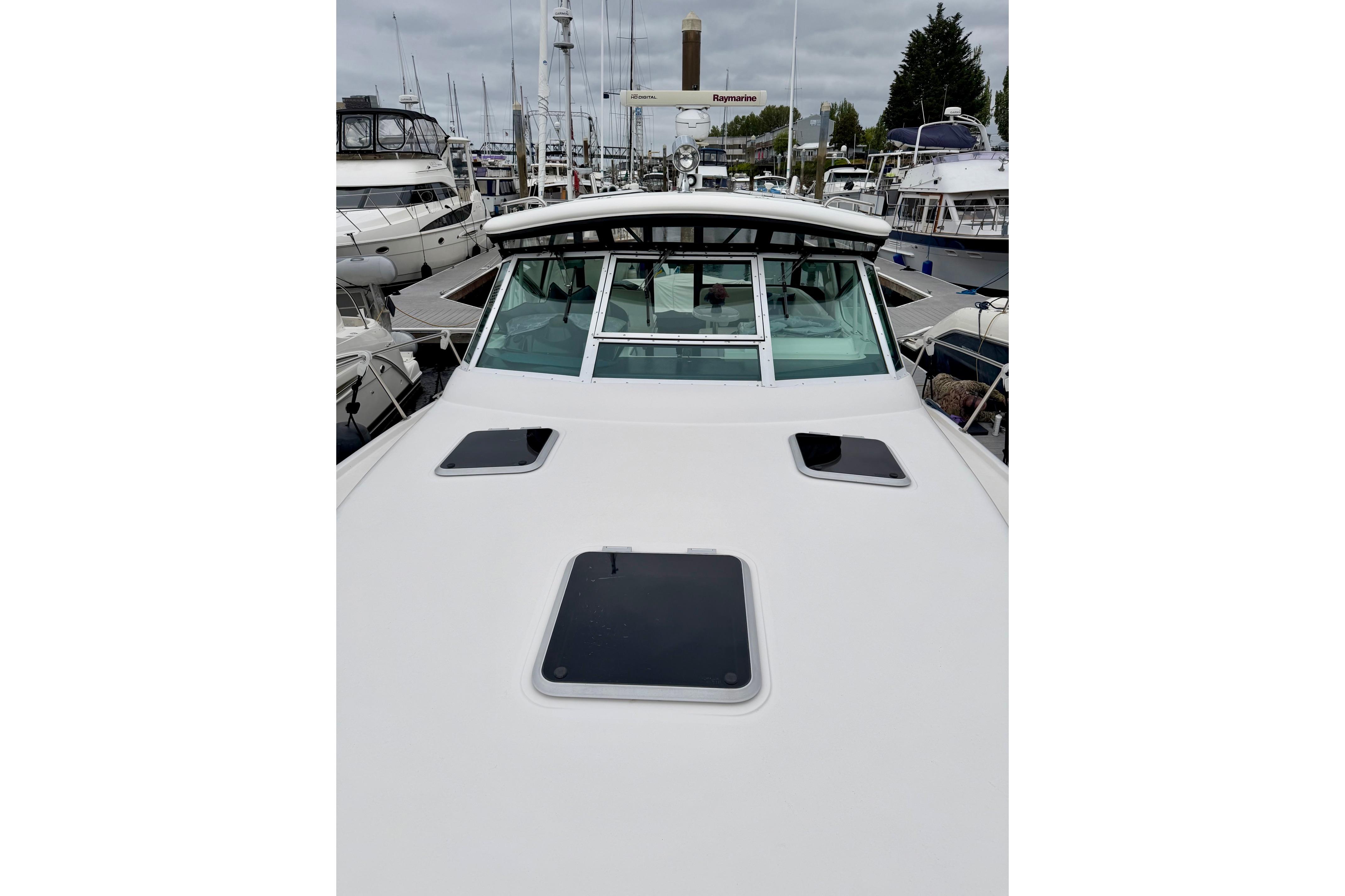 2003 Tiara Yachts 3500 Open at marina, showcasing sleek design and spacious deck.