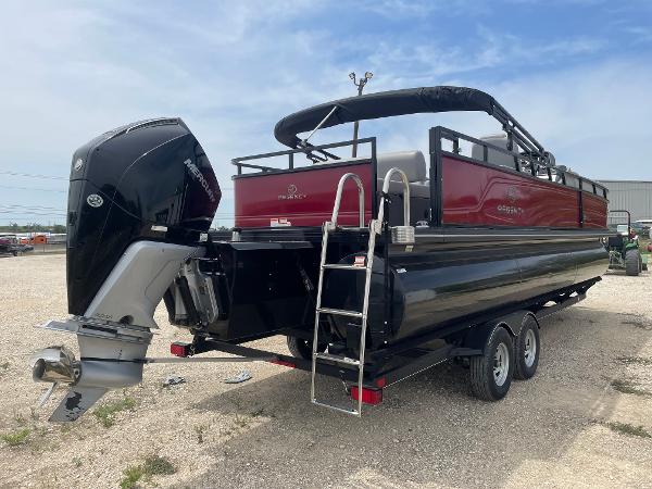 2023 Regency 250DL3 pontoon boat with outboard motor and trailer, parked outdoors.