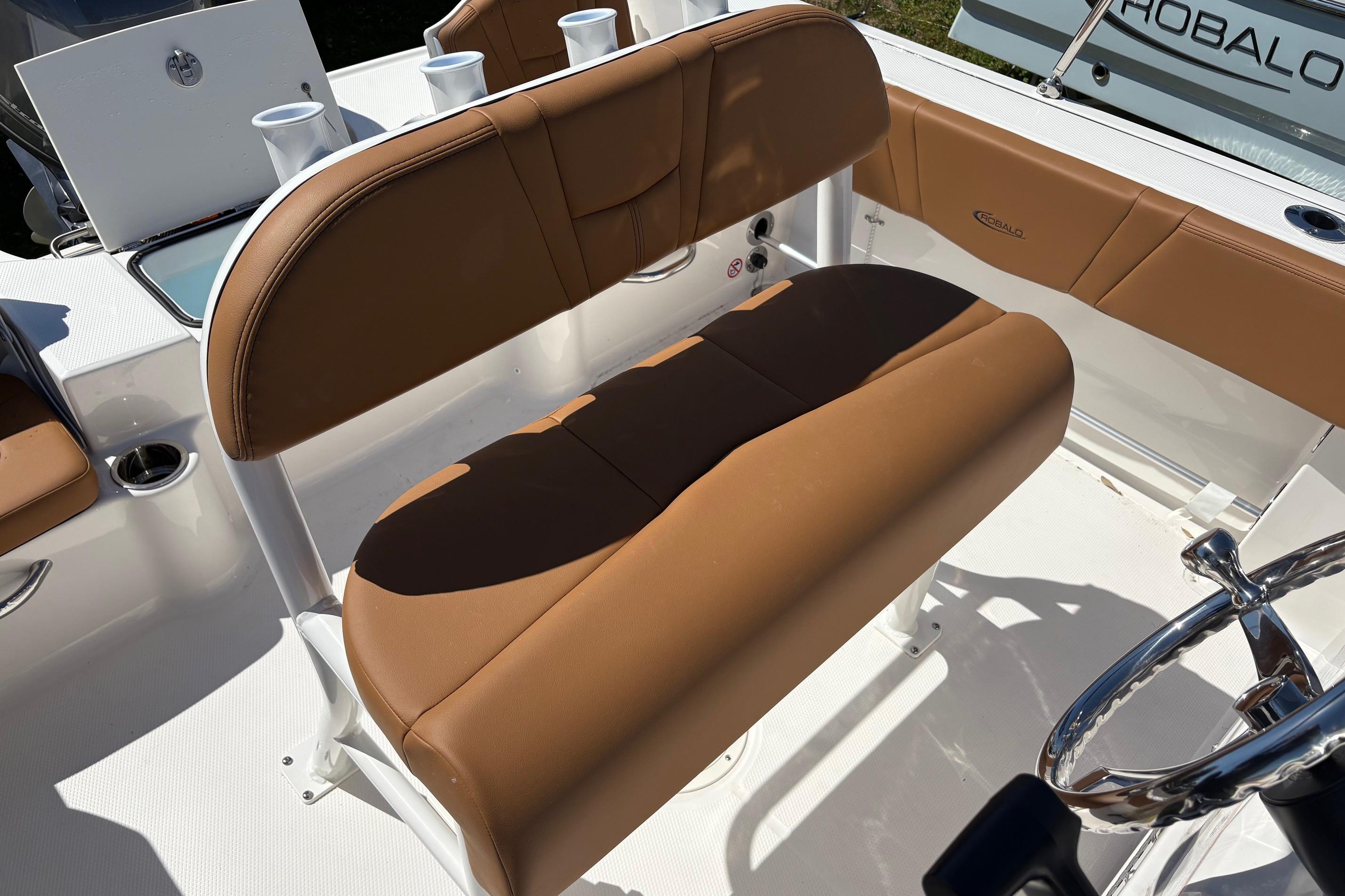 2026 Robalo R180 Center Console boat with tan seating and steering wheel.