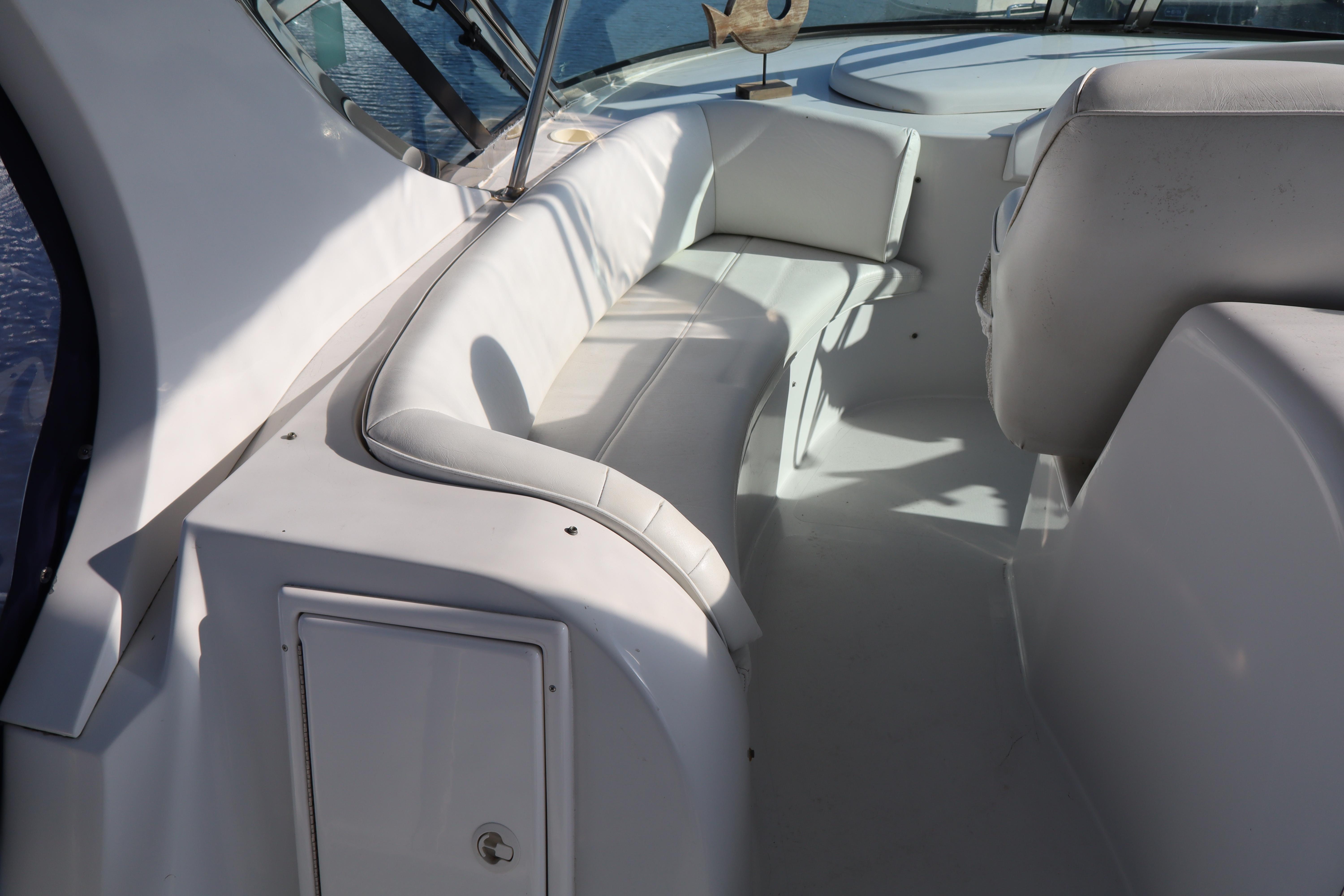 2006 Bluewater Yachts 5200 interior with white seating and sleek design.