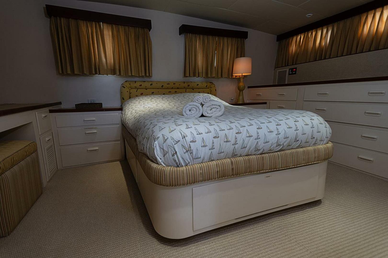 Luxurious bedroom interior of 1969 Derecktor 68 Hunt Motor Yacht with elegant decor.