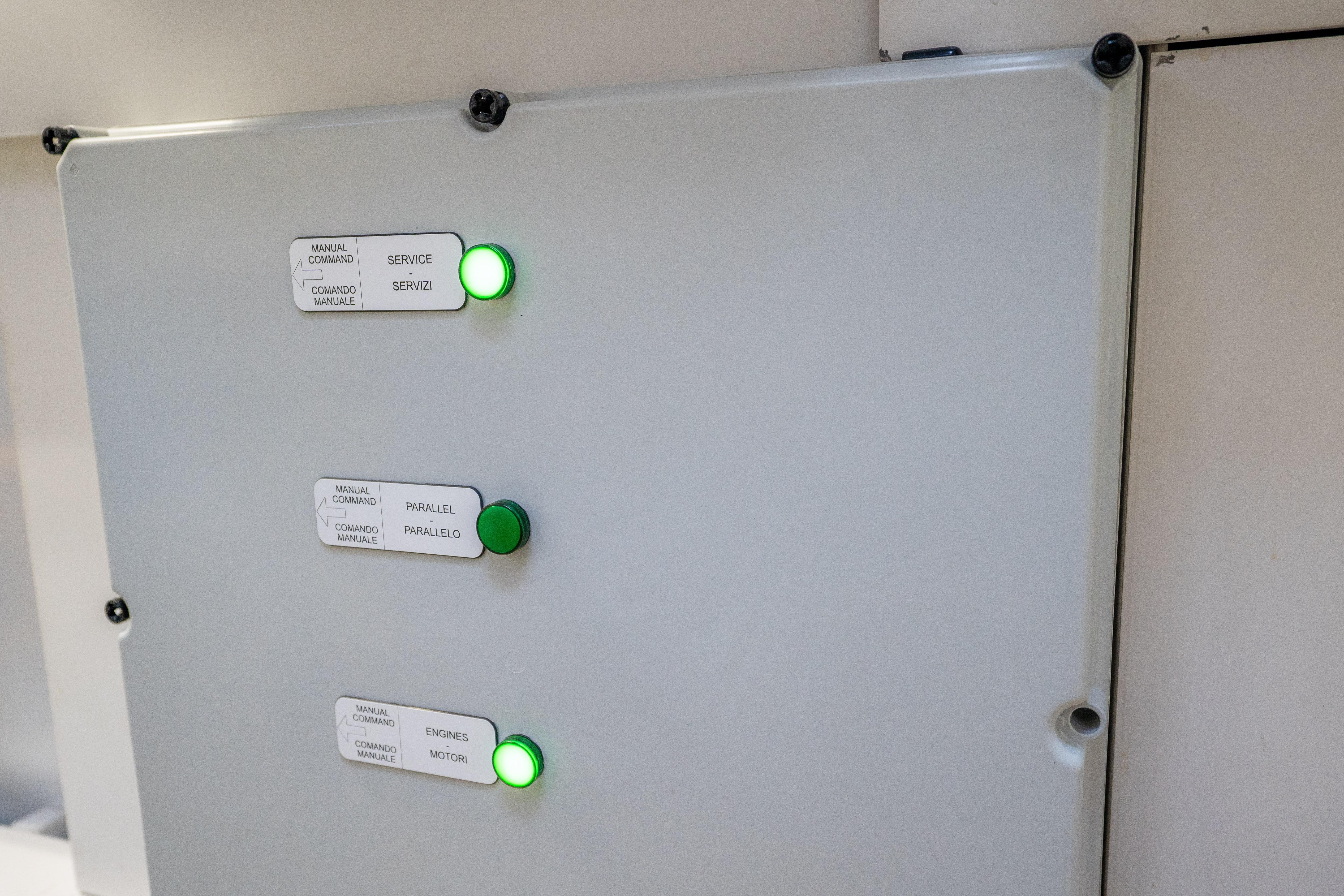 Control panel with green indicator lights on a 2024 Pershing 7X yacht.