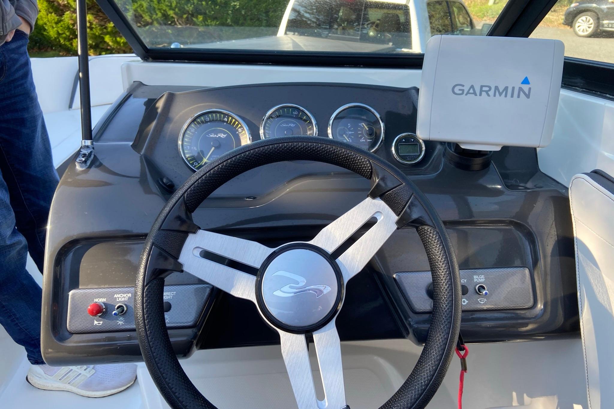 2016 Sea Ray SPX 210 Outboard dashboard with Garmin navigation system and steering wheel.