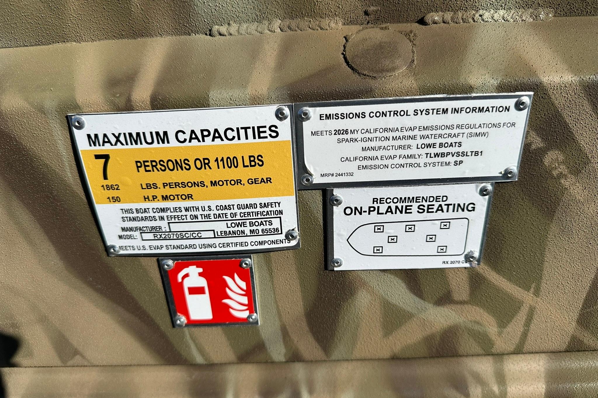 Lowe Roughneck 2070CC 2026 boat capacity and emissions information labels.