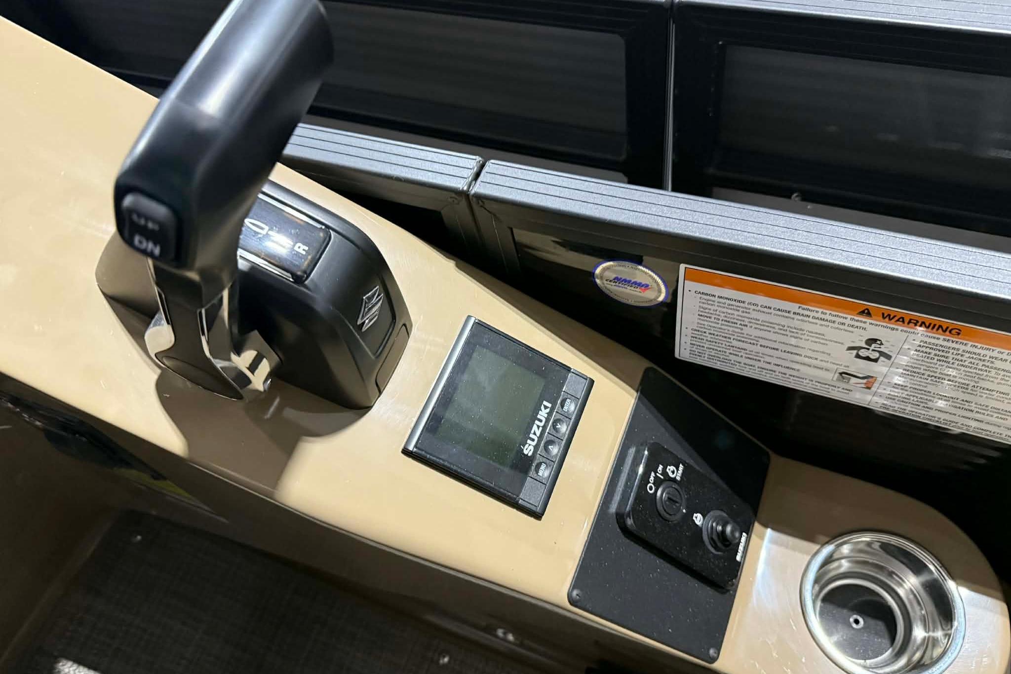 Control panel of 2026 Manitou Encore VP 230 boat with throttle and display.