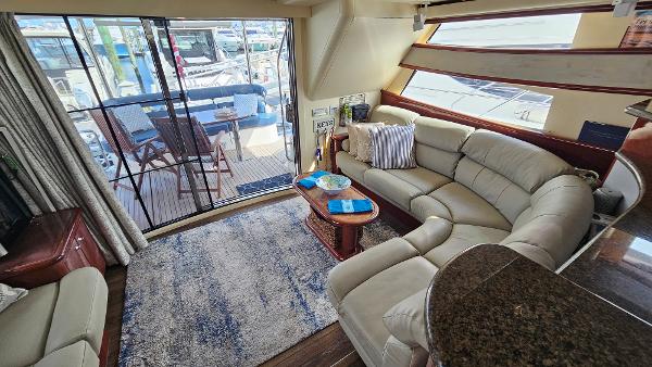 Luxurious interior of 2005 Neptunus 56 Flybridge yacht with plush seating and elegant decor.