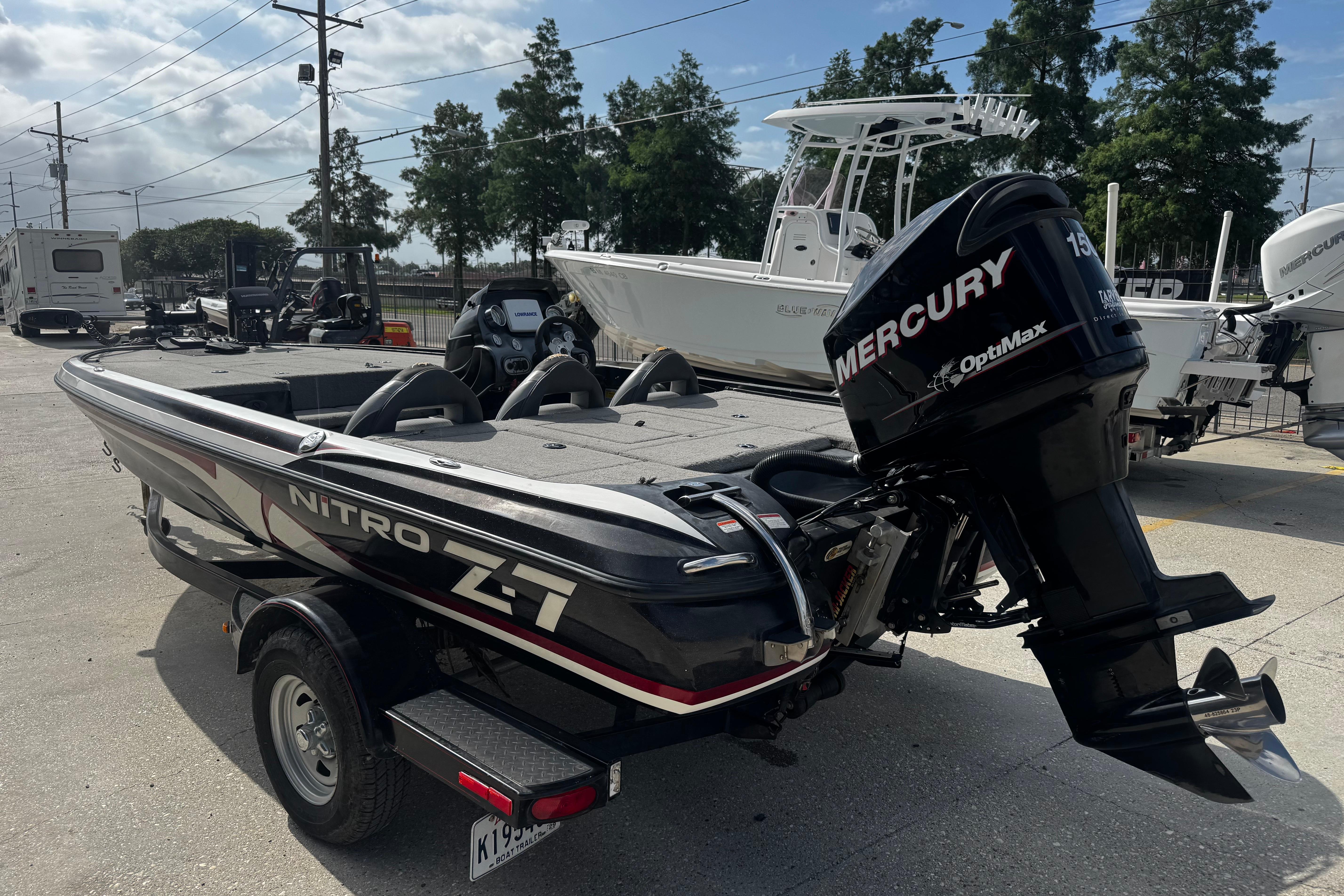 2012 Nitro Z-7 boat with Mercury OptiMax engine on trailer.