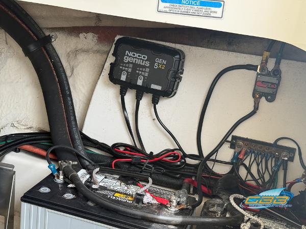 Battery compartment of a 2008 Sea Ray 270 SLX with NOCO Genius GEN5X2 charger.