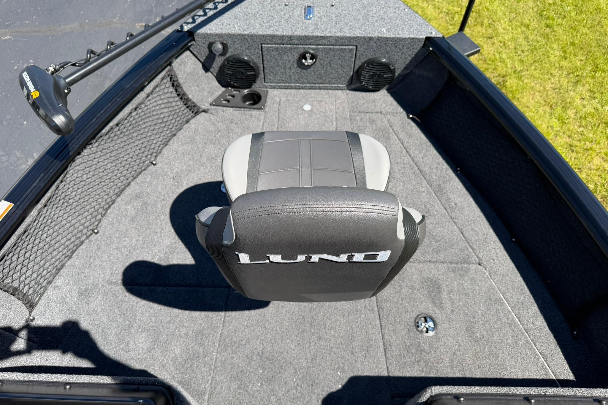2027 Lund 1775 Impact XS Sport boat interior with gray seating and fishing equipment.