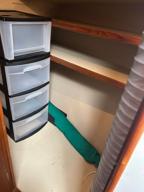 Interior of a 1980 Grand Banks 32 Sedan with storage space.